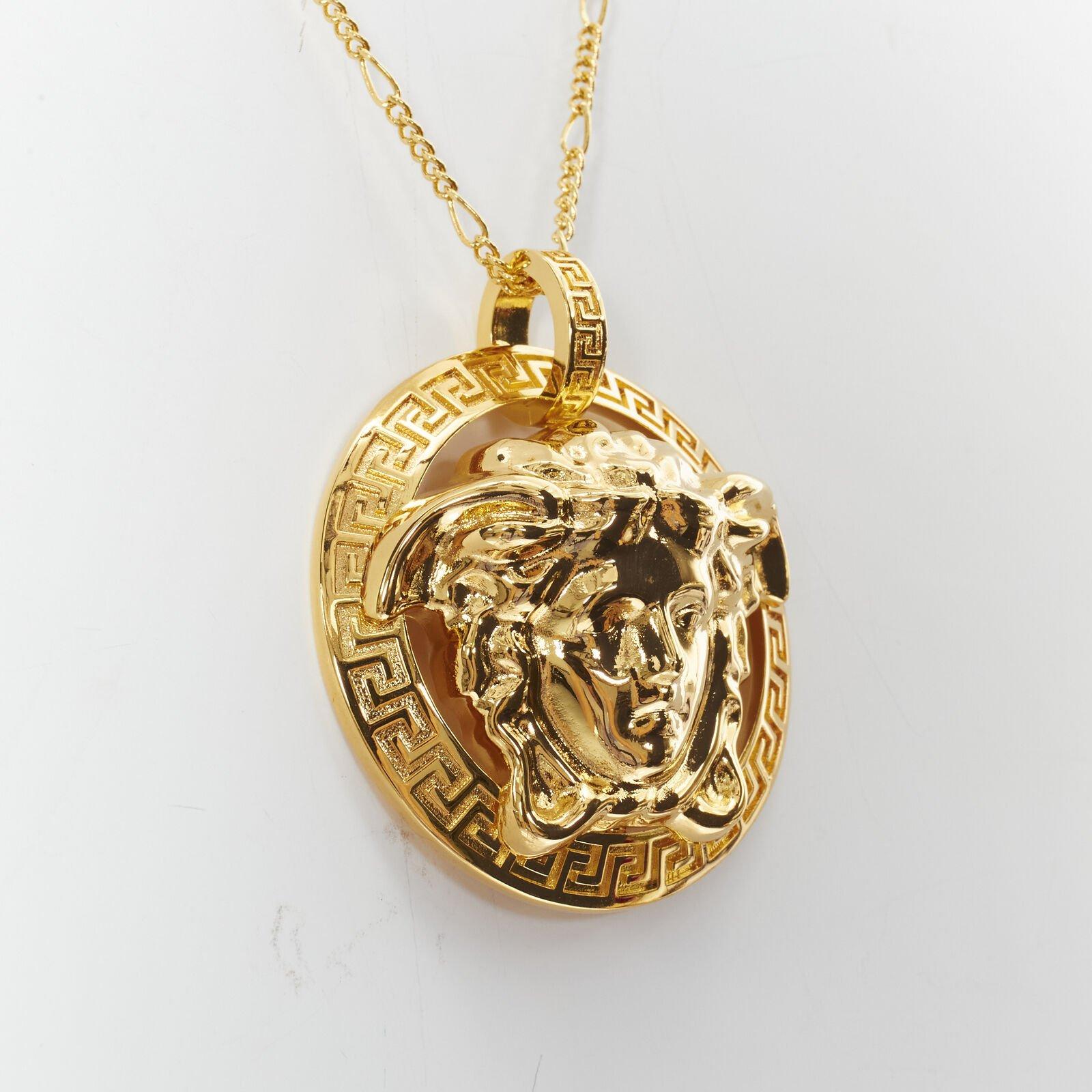 VERSACE Medusa Greca coin medallion gold tone nickel short necklace
Reference: TGAS/B01127
Brand: Versace
Designer: Donatella Versace
Material: Nickel
Color: Gold
Pattern: Solid
Closure: Clasp
Extra Details: Oversized 3D Medusa head with Greca