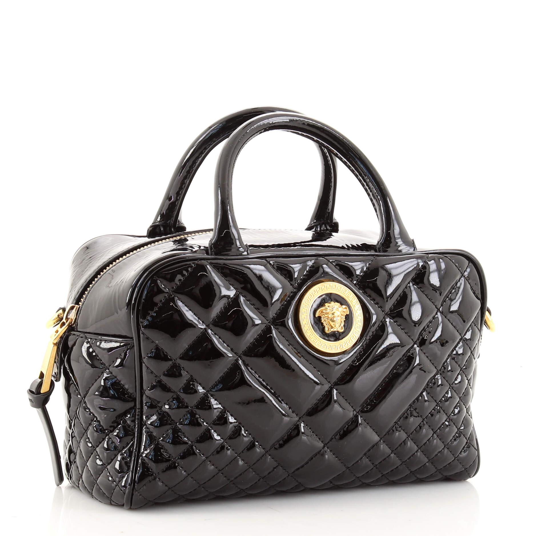 Condition: Fair. Creasing on exterior and strap, marks on base corners. Cracking and peeling on handle base wax edges, heavy discoloration and marks in interior, scratches and discoloration on hardware.
Accessories: Detachable Strap
Measurements: