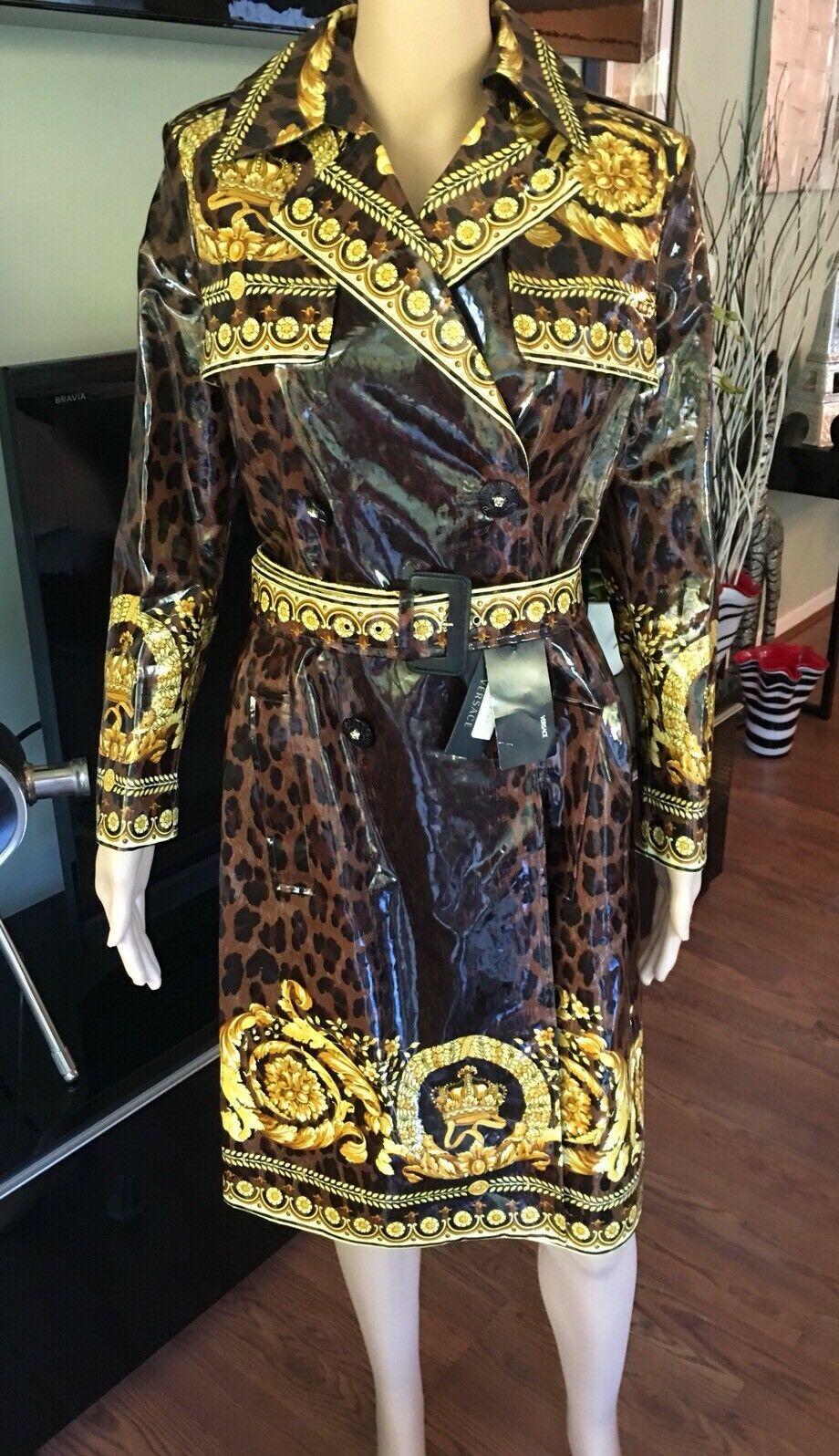 Versace Medusa Signature Print Rain Jacket Coat IT 42

Versace leopard print double-breasted rain coat featuring notched lapels, dual seam pockets, tonal sash tie belt at waist and button closures at front.

About Versace: Founded in 1978 by the