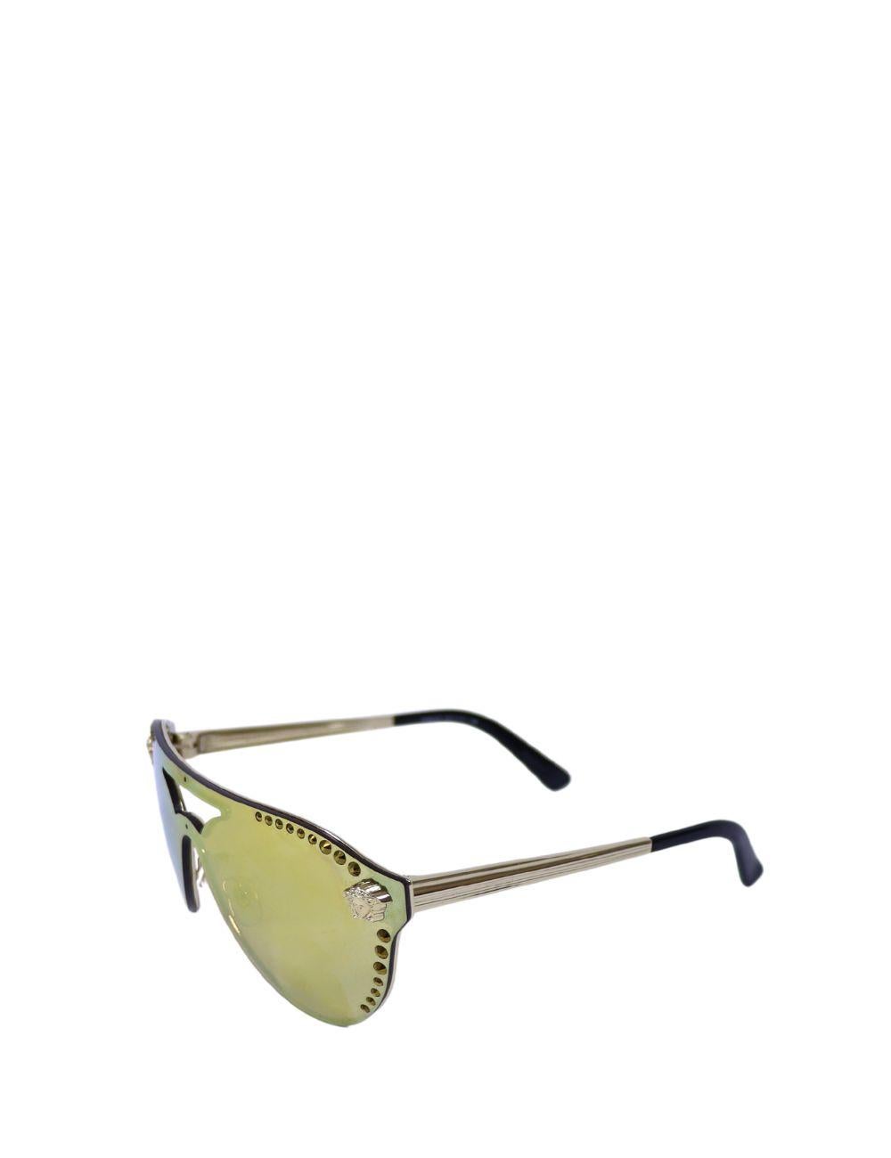 Turn heads with these bold Versace shield sunglasses featuring a futuristic mirrored lens and signature Medusa detailing. Designed with a sleek gold-tone metal frame and studded accents along the lens border, these sunglasses exude Versace's