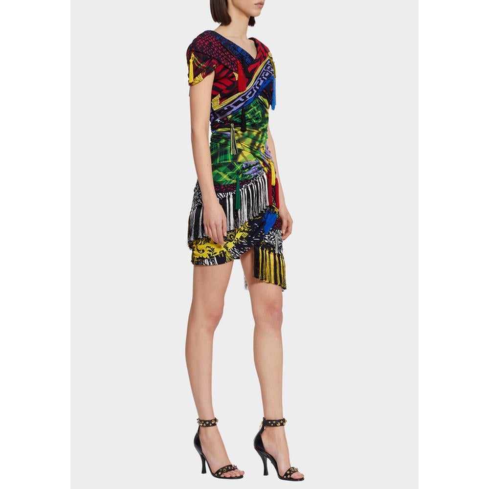 Versace's mini dress is awash with a clash prints and multi-colored tassel trim. Sleek bodycon silhouette emphasizes curves with its ruched wrap design and an asymmetrical hem.
V-neck
Short sleeves
Concealed back zipper
Back v-neck
Asymmetrical