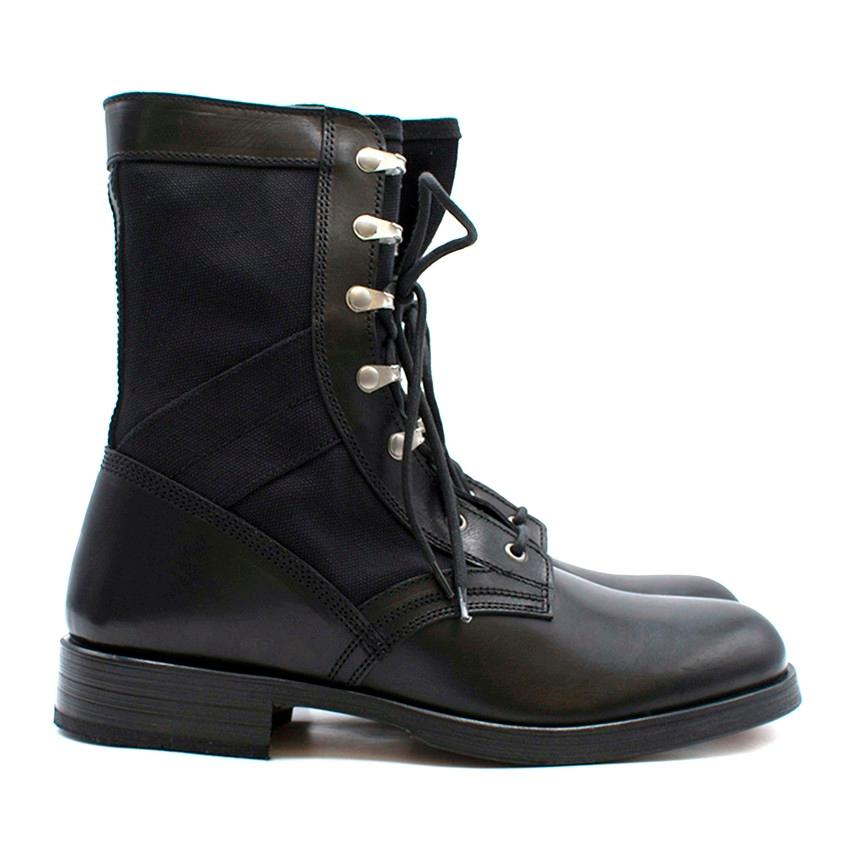 Versace Men's Lace Up Stivaletto Boots

- Round toe
- Canvas sides
- Silver-tone hardware
- Lace up front
- Black sole and midsole 

Please note, these items are pre-owned and may show some signs of storage, even when unworn and unused. This is
