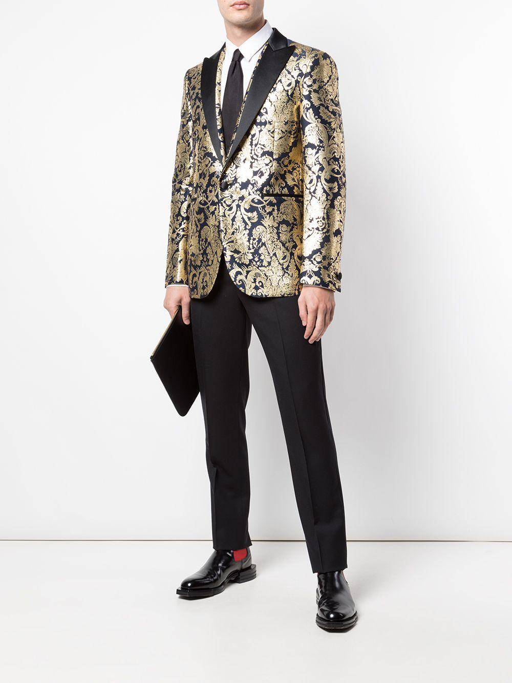 Versace Mens Navy Gold Metallic Barocco Brocade Blazer/ Dinner Jacket

Channel your inner extrovert in this Barocco brocade blazer from Versace. Made from a silk-cotton blend, this stand-out piece has been designed with satin peaked lapels and is