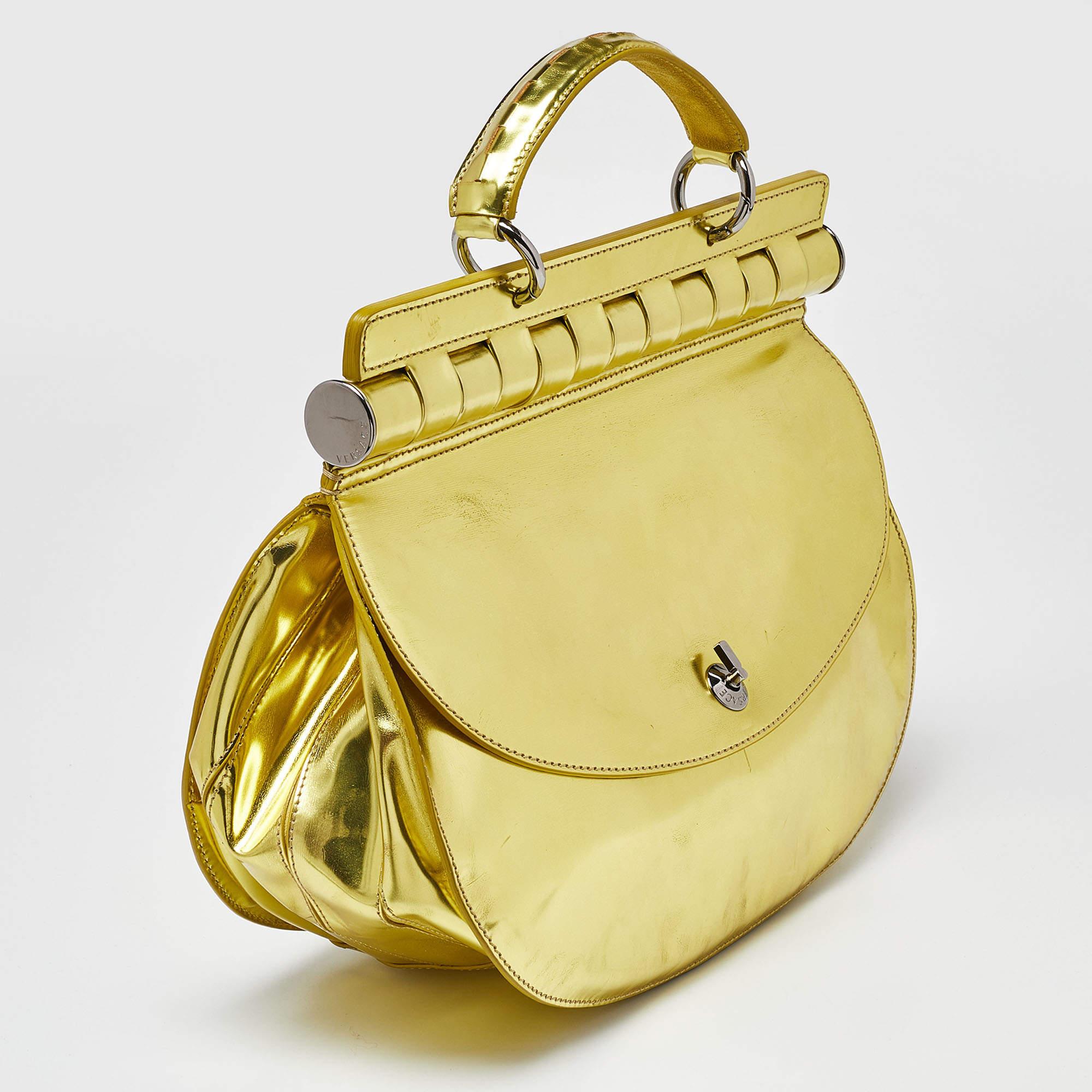 Indulge in timeless luxury with this Versace bag for women. Meticulously crafted, this exquisite accessory embodies elegance, functionality, and style, making it the ultimate companion for every sophisticated woman.

