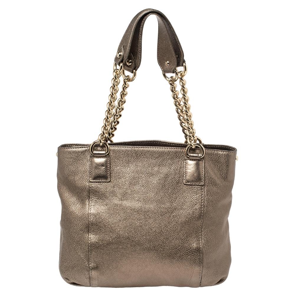 This shiny leather bag is gorgeous enough to upgrade any look. It boasts a perforated Medusa motif on the front, two handles, and a spacious fabric-lined interior. This Versace hobo in a metallic hue is just what you need to finish your look.

