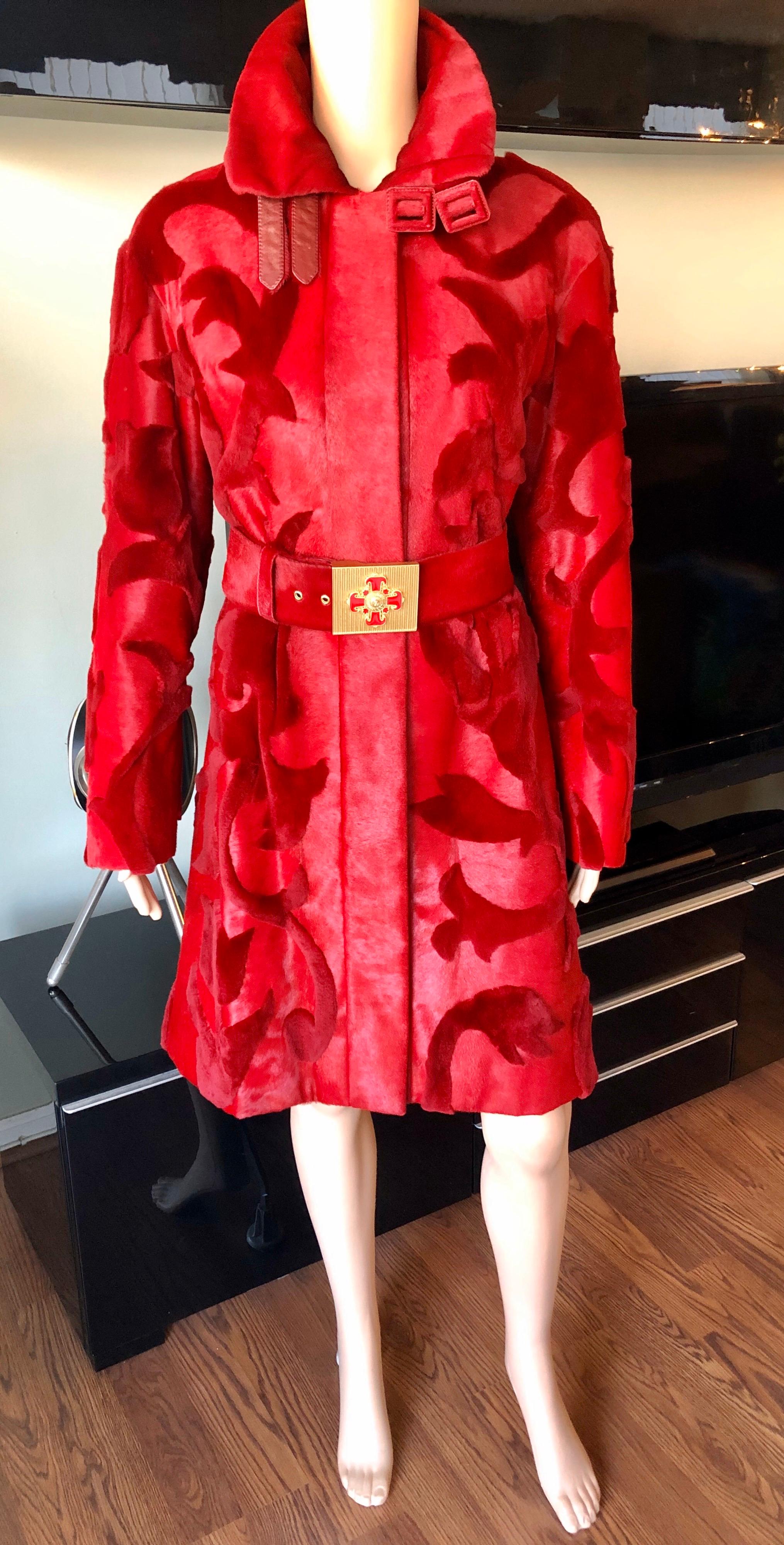 Versace Mink Fur and Leather Belted Knee-Length Red Jacket Coat IT 42

Versace mink fur and leather knee-length red coat featuring floral pattern throughout, stand collar with dual belt accents and pull-through buckle closures, removable belt with