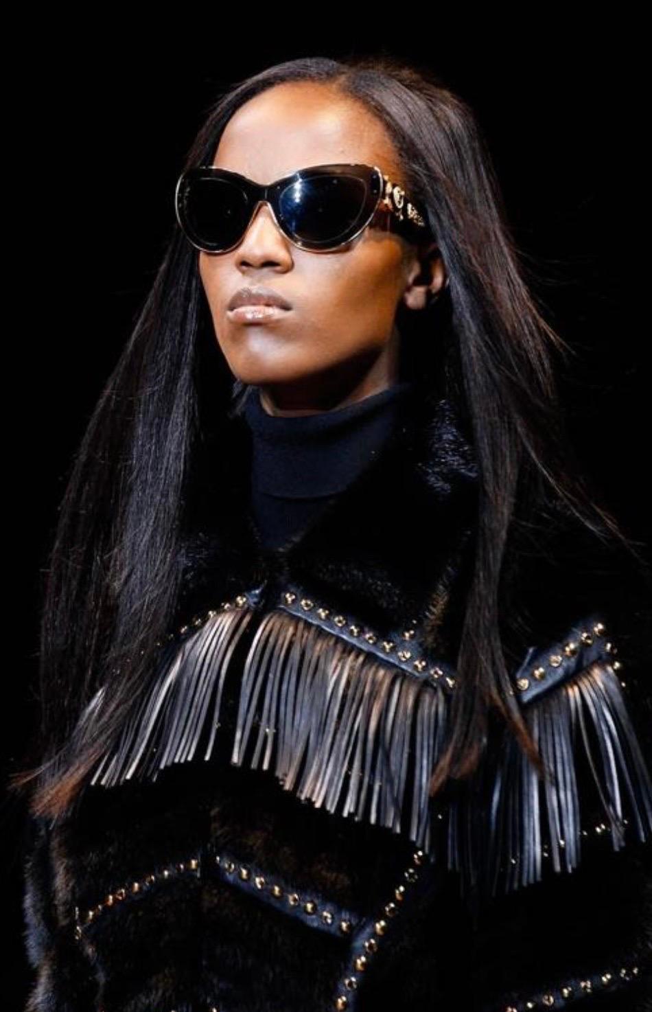 VERSACE
Actual runway sample Fall/Winter 2014 look #19
Mink fur cropped jacket with gold studs, crystals and leather fringe
Content: 100% mink, 100% leather
Lining: 100% silk
Inner pocket
IT Size 38 - 2
armpit to armpit 18