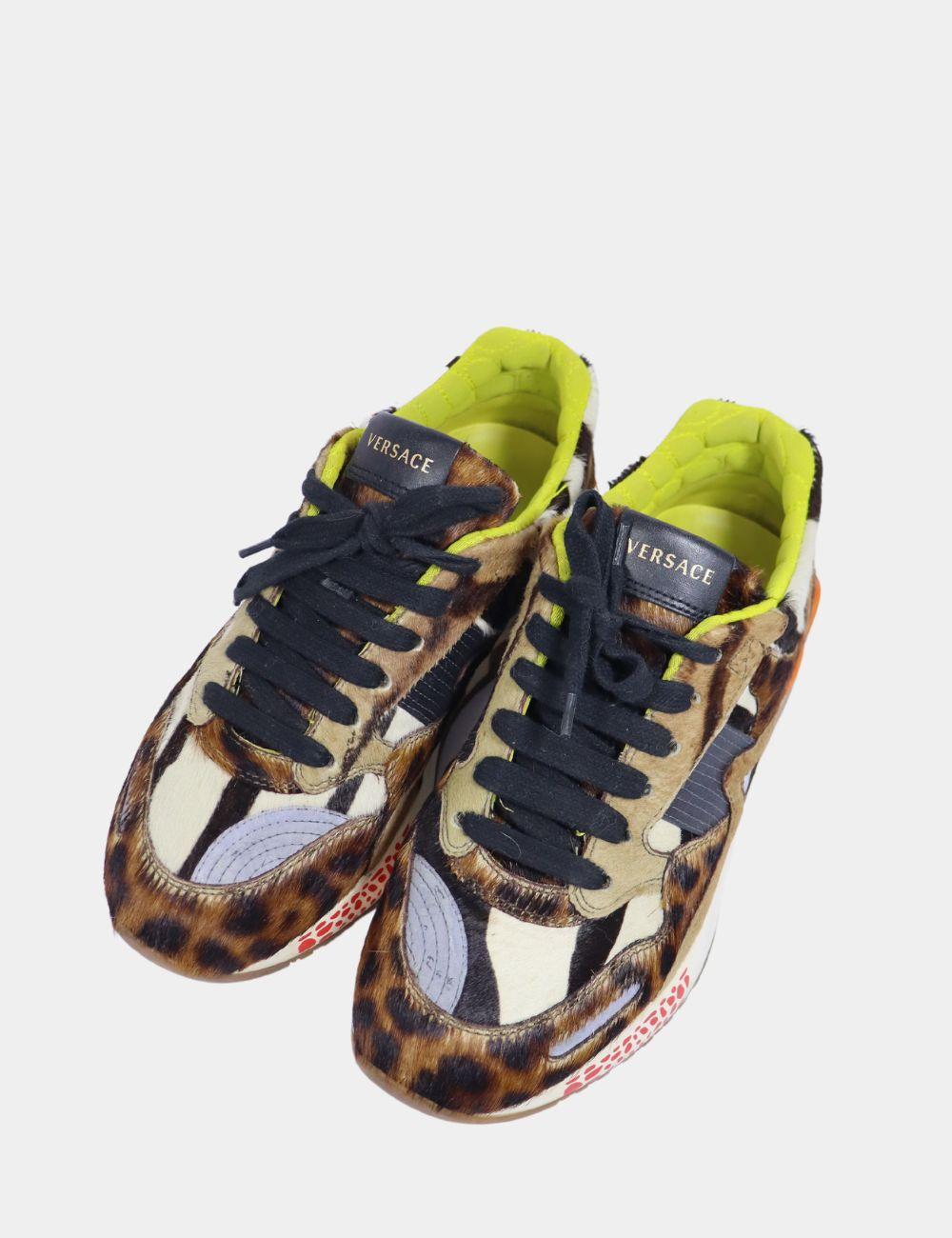 Versace Multicolor Animal Print Fur And Leather Sneakers, Features almond toes and lace-up on the vamps, rubber soles and lace up style.

Material: Leather
Size: EU 37.5
Overall Condition: Good
Interior Condition: Signs of use
Exterior Condition: