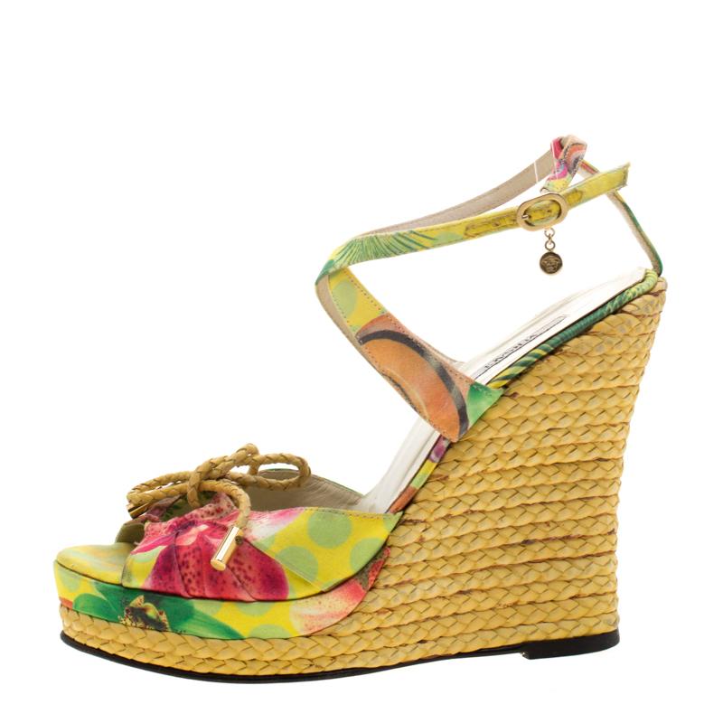 These Versace wedge sandals will bring you the perfect amount of style and comfort. Crafted from printed satin, they feature cutouts on the upper straps, buckle fastenings around the ankles, and espadrille wedge heels. They are lovely and easy to