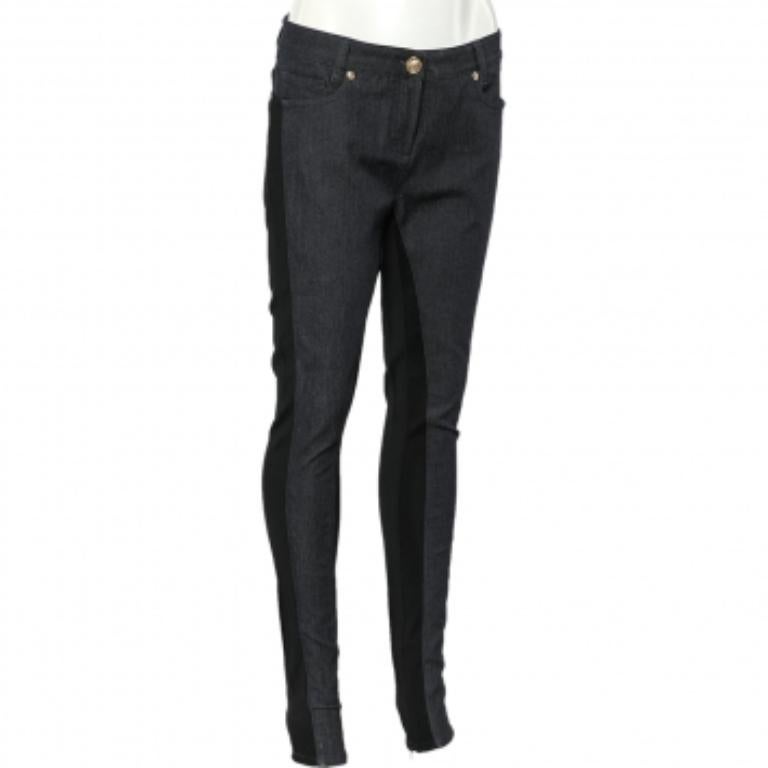 Your wardrobe is never complete without a good pair of jeggings! These stunning jeggings from the House of Versace are designed to bring comfort and style to your look. They are tailored from navy-blue denim and black jersey fabric. They are