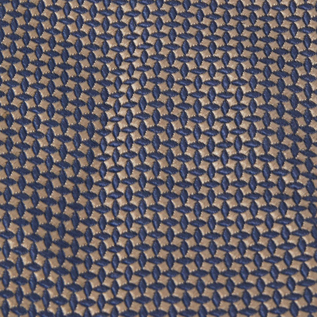 This tie is a perfect formal accessory that has a sharp and modern appeal. Made from luxurious materials  it features intricate patterns  and the brand label neatly stitched at the back. It is sure to add oodles of style to your blazers.