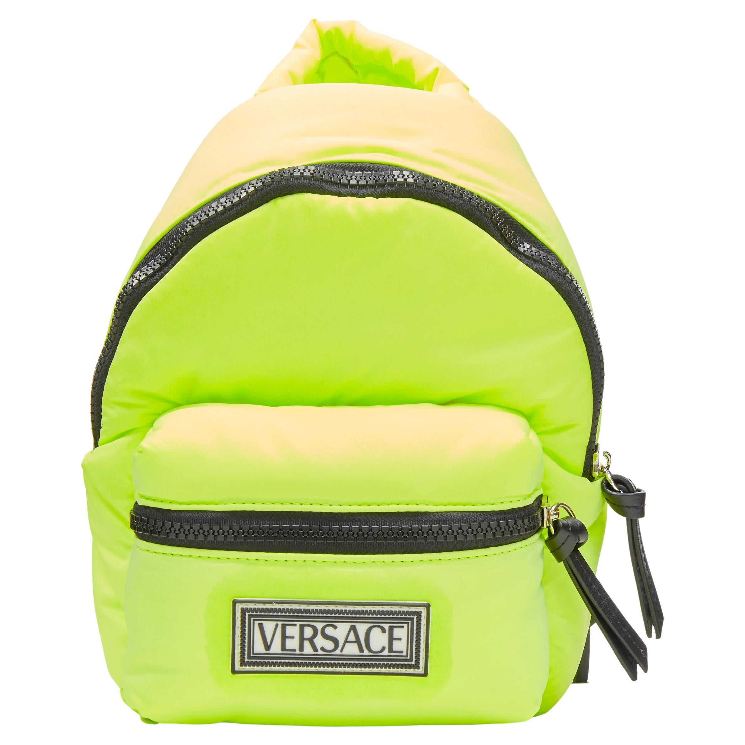 VERSACE neon yellow nylon 90's logo crossbody sling backpack For Sale at  1stDibs