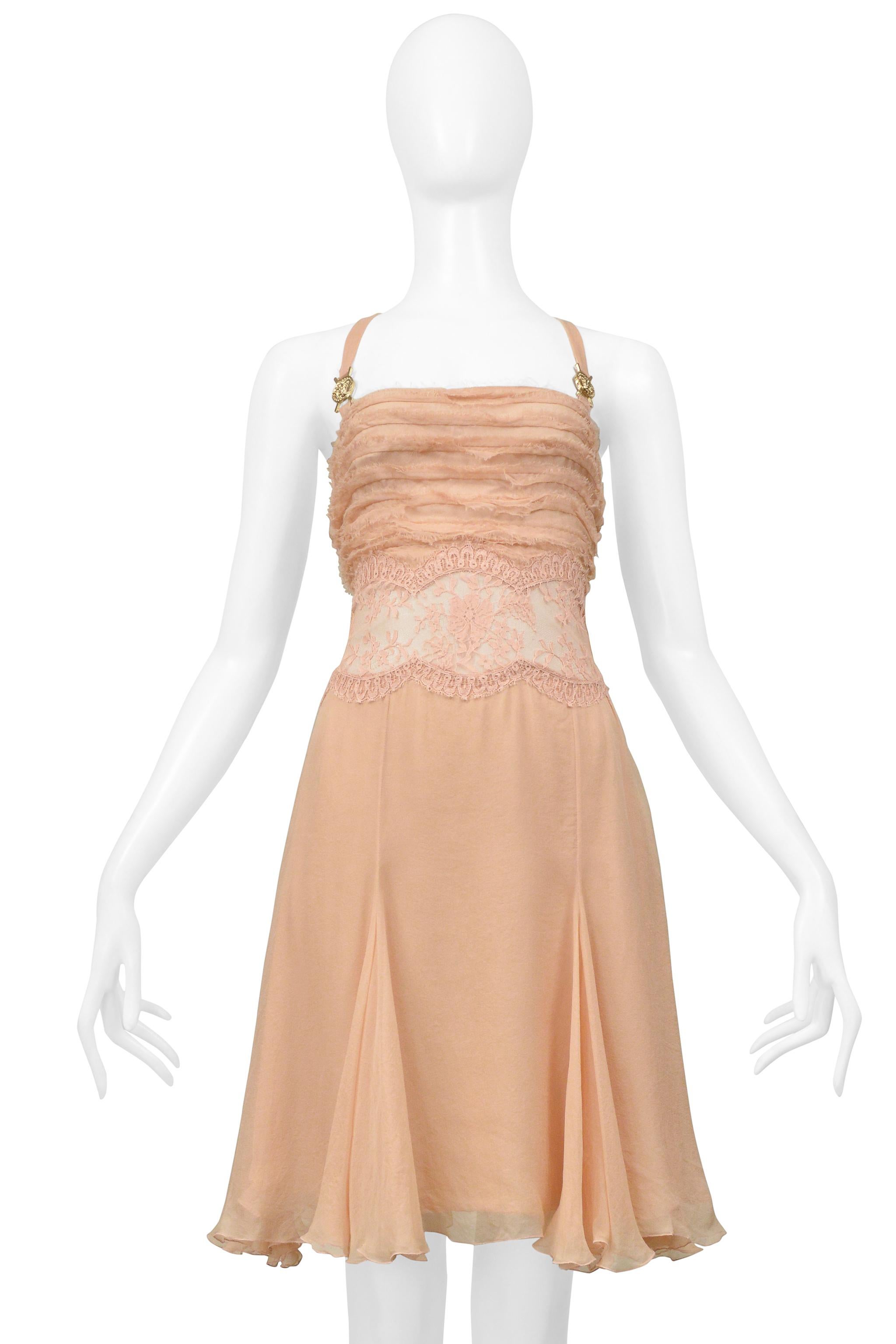 Resurrection Vintage is excited to offer a vintage Versace pink and silk dress with gold hardware. The dress features Versace Medusa hardware on straps, a frayed sheer silk bodice, a scalloped edge pink sheer lace at the waist, and a layered chiffon
