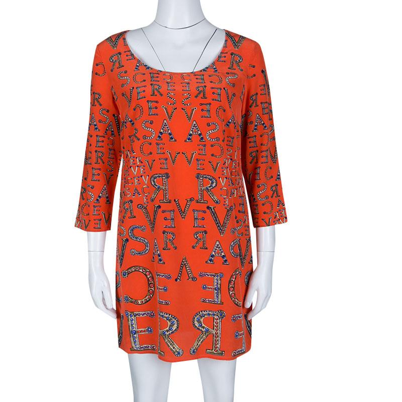 Style this orange dress with twin accessories for the ideal look. Made in 100% silk, it lends great style and a modest finish. Express your love for modern-day style and fashion by donning this fantastic piece from the house of Versace.

Includes: