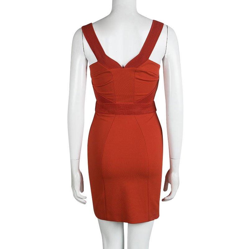 The Versace bodycon dress is detailed with tonal textured sleeveless straps and a V neckline, with a similar empire waistband. The waistband accentuates your curves and gives a flattering bodycon fit, perfect for your evening occasions. The exposed
