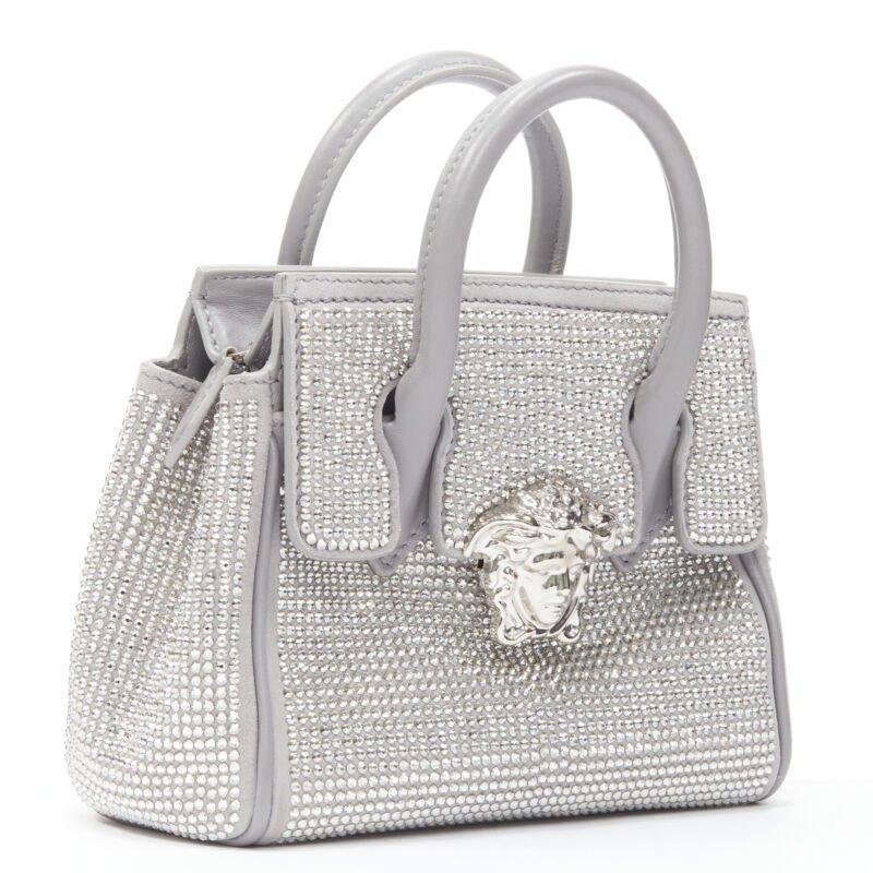 VERSACE Palazzo Empire Mini Limited Edition grey crystal crossbody bag
Reference: CNLE/A00151
Brand: Versace
Designer: Donatella Versace
Model: Empire Mini
Material: Leather
Color: Grey
Pattern: Solid
Closure: Zip
Lining:  Fabric
Extra Details: This