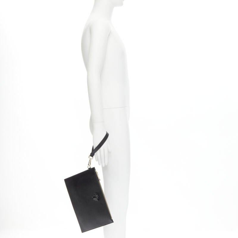 VERSACE Palazzo Medusa emblem black saffiano leather zip pouch clutch
Reference: TGAS/C00128
Brand: Versace
Designer: Donatella Versace
Material: Leather
Color: Black, Gold
Pattern: Solid
Closure: Zip
Lining:  Fabric
Extra Details: Tonal Medusa