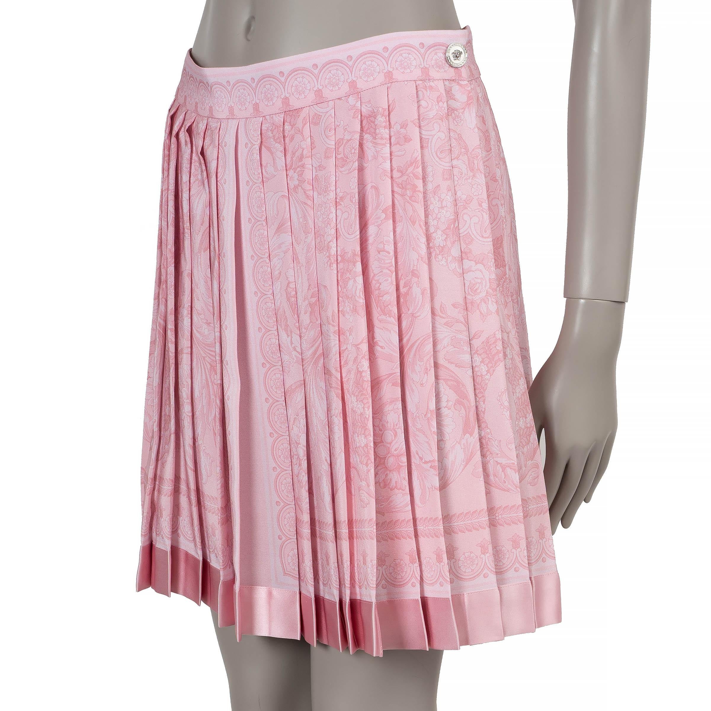 This 100% authentic Versace skirt in lightweight pale pink crepe silk (100%) is adorned with the iconic Barocco print, embodying the brand's opulent aesthetic. Designed with a high-waisted, straight silhouette and mini length, it features structured