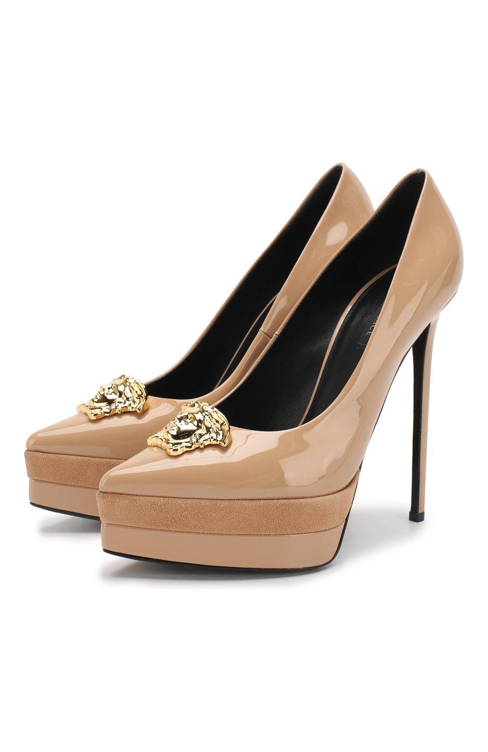 Versace Patent Nude with Gold Medusa Head Palazzo Platform Pump

Founded in 1978 by the late Gianni Versace, this Italian design house specializes in sizzling glamour. Gianni's sister, Donatella Versace, has designed the label since 1997, creating