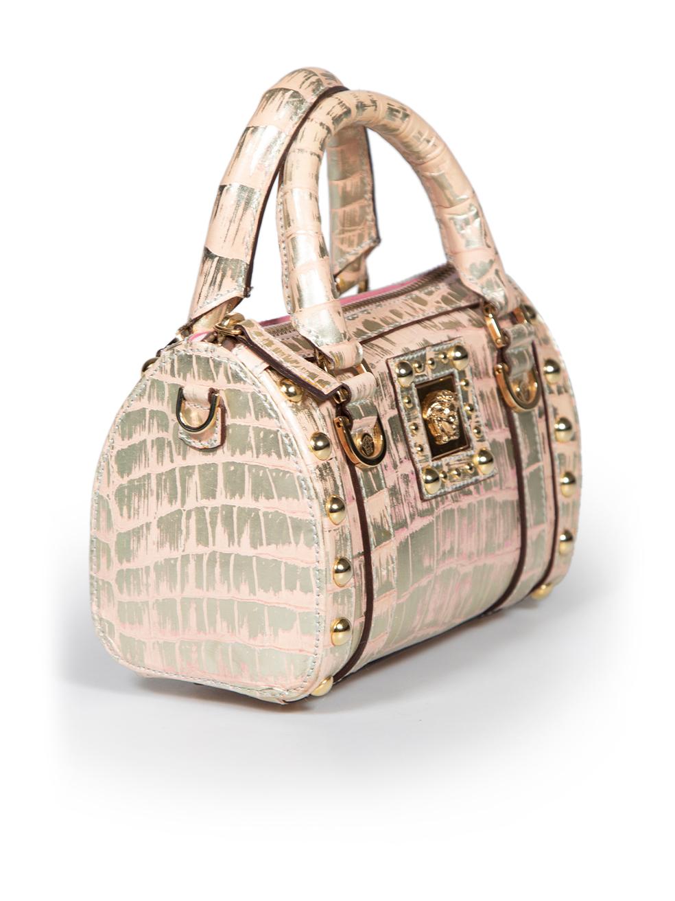 CONDITION is Very good. Minimal wear to bag is evident. Minimal wear to the front and sides with marks and scratches to the leather on this used Versace designer resale item.
 
 
 
 Details
 
 
 Pink
 
 Leather
 
 Mini crossbody bag
 
 Crocodile