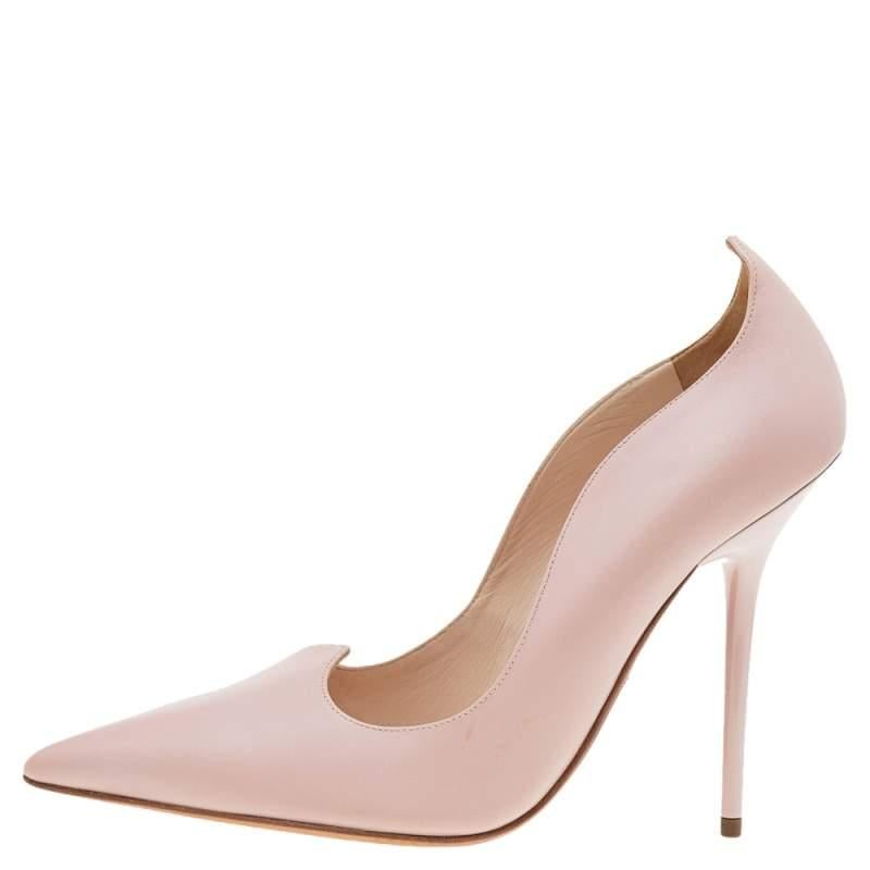 This Versace pair of pumps is a perfect example of fashion with function. Covered from leather in a pink hue it features silver tone hardware and pointed toes. Balanced on 12cm heels it will definitely lift your fashion spirits.