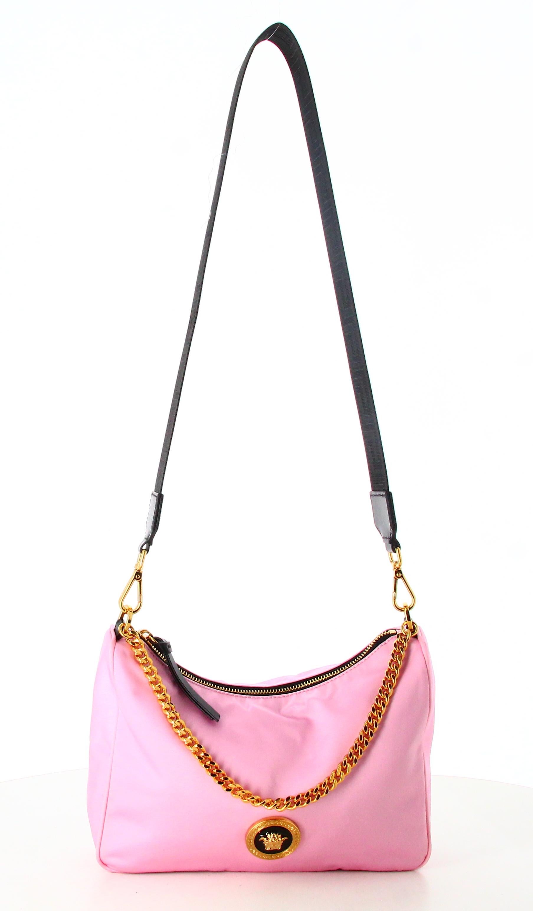 Versace Pink Nylon Shoulder Bag

- Very good condition. Shows very slight signs of wear over time. 
- Versace shoulder bag 
- material : Nyon 
- Colour : Pink and golden 
- Golden and black Versace logo 
- Black fabric shoulder strap plus golden