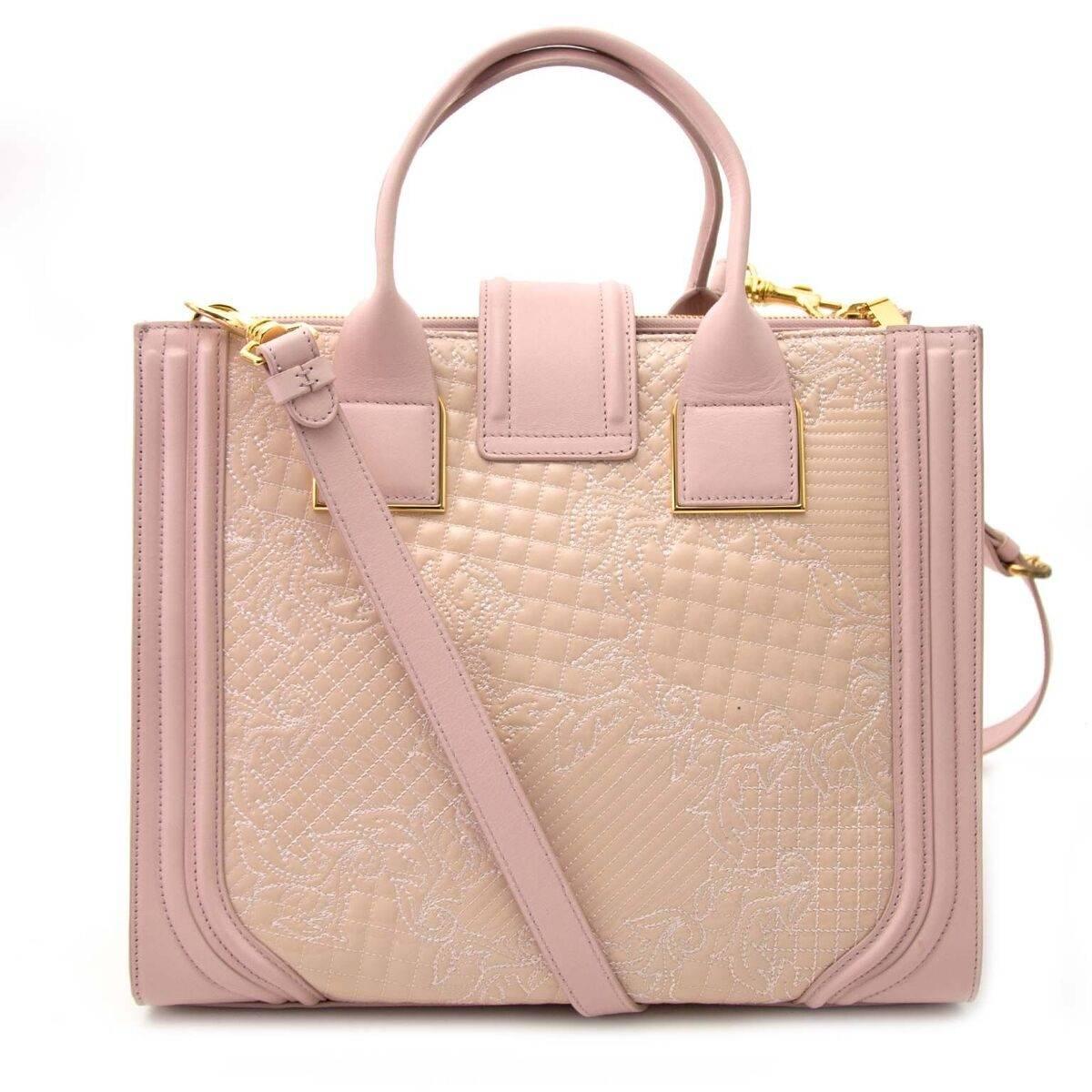 As new!

Versace Pink Powder Icon Quilted And Patent Leather Bag

This iconic Versace bag comes in quilted pink and patent leather.
It's classic chic and refined style will be perfect for the upcomming warmer weather.
The shiny patent and quilted