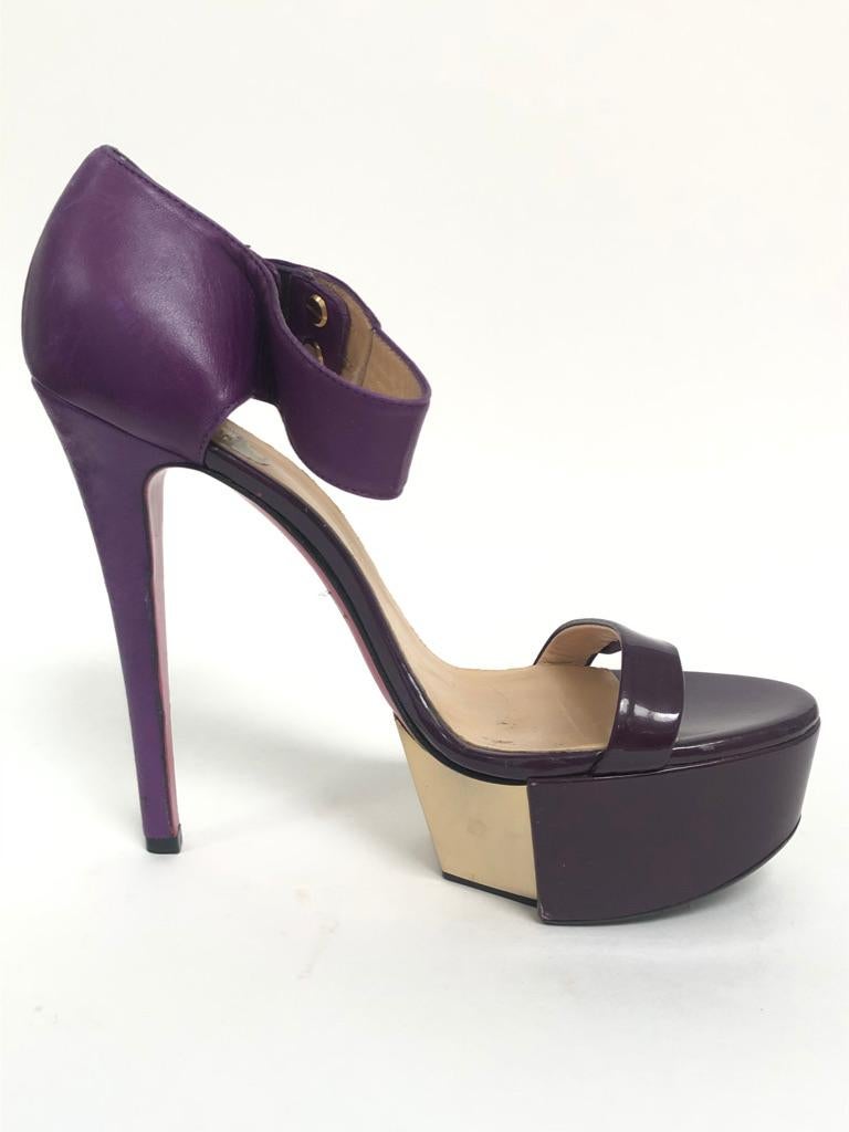 Open toe sandals with thick ankle strap, metal platform. 