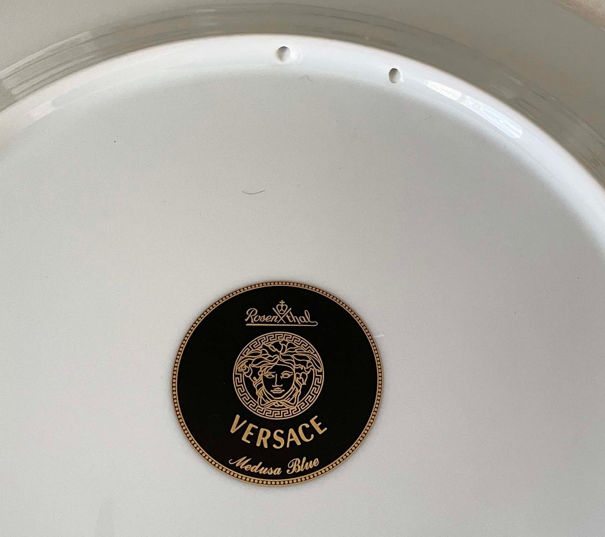 An blue Versace porcelain Medusa display plate manufactured by Rosenthal, Germany.  

Decorated in gold, blue and black to create a high quality accessory,  in the original Versace gift box.

Rosenthal GmbH is a German manufacturer of porcelain