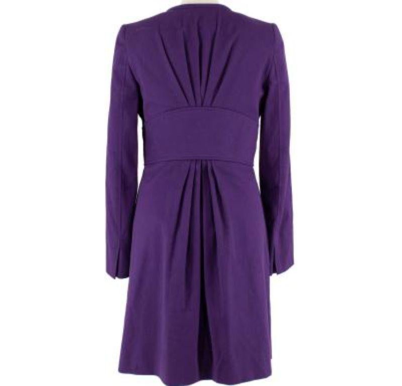 Versace Purple Silk Blend Coat with Gold Belt Detail 

- Rich purple cotton and silk blend textured woven coat 
- Collarless longline silhouette 
- Built in belt detail with golden front clasp
- Hidden buttons down the front 
- Shoulder pads 
- Silk