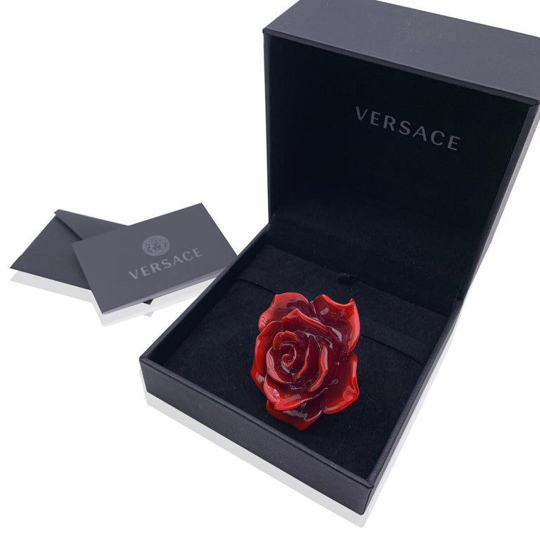Beautiful Versace oversized red rose statement ring. Crafted shiny resin. Gold metal ring. Size: 15 (US size 7). Max width on the top: 2.5 inches - 6.3 cm. 'Versace - Made in Italy' engraved internally. Retail price was 550 euros Condition A+ - MINT