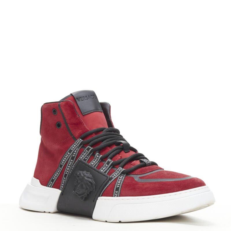 VERSACE red suede Medusa emblem nastro logo ribbon high top sneakers EU40
Reference: TGAS/B01046
Brand: Versace
Designer: Donatella Versace
Material: Suede
Color: Red
Pattern: Solid
Closure: Lace Up
Lining: Leather
Extra Details: Red suede leather.