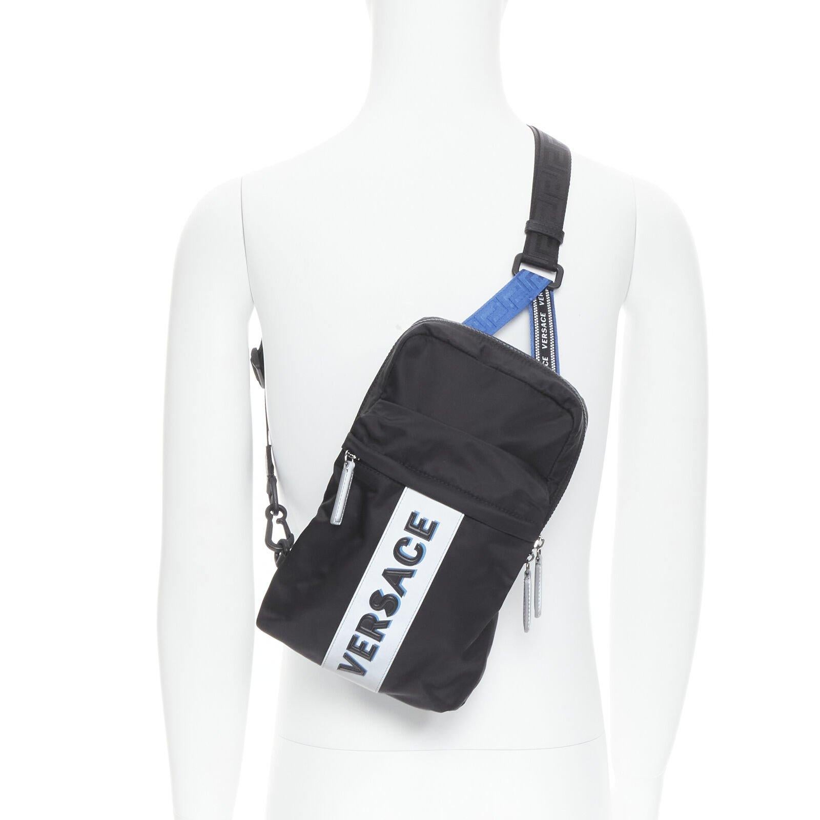 VERSACE reflective logo black nylon Greca sports strap sling crossbody bag
Reference: TGAS/C00860
Brand: Versace
Designer: Donatella Versace
Model: DFZ8076 DNY2R K046E
Collection: Pre Fall 2020 - Runway
Material: Nylon
Color: Black, Blue
Pattern: