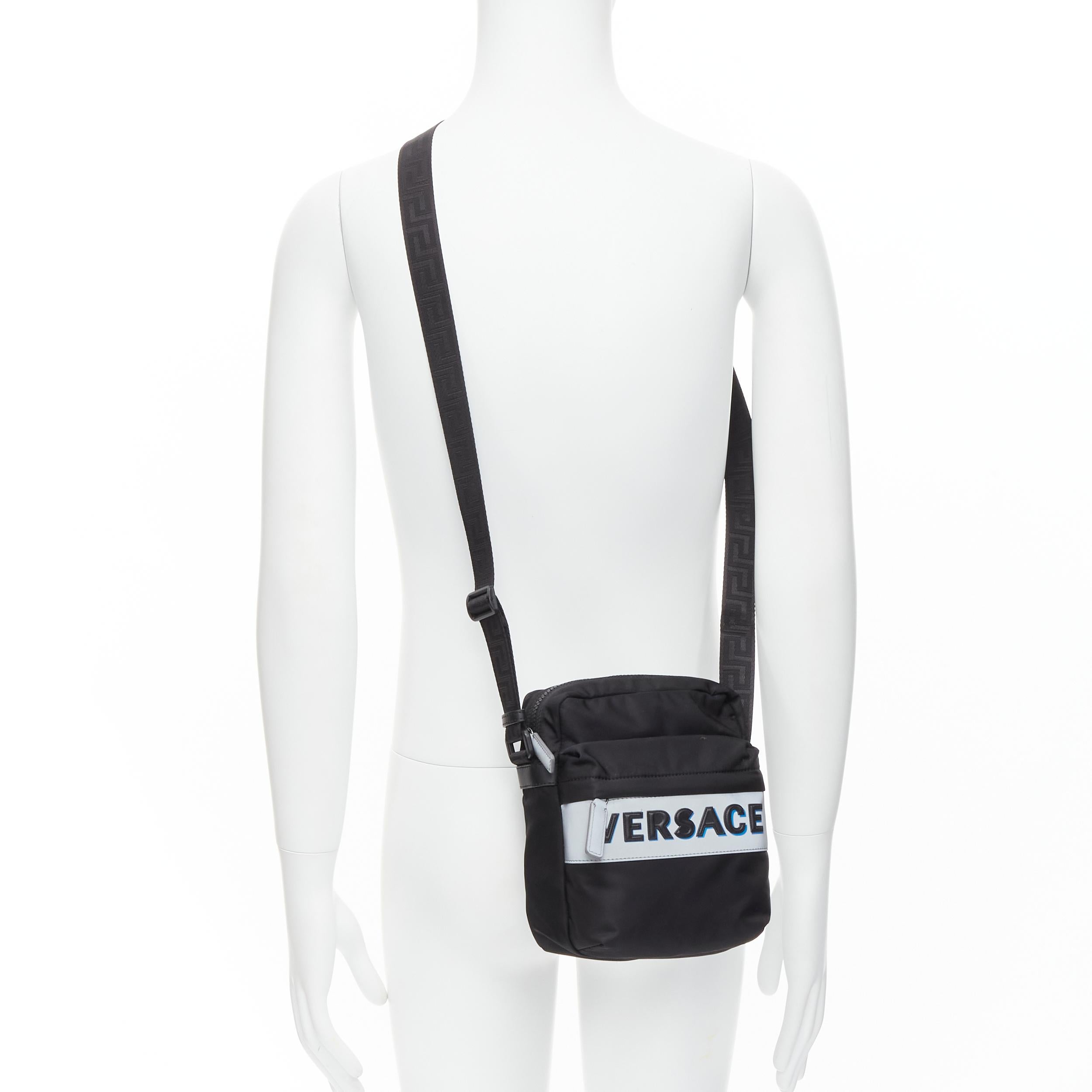 VERSACE reflective logo black nylon Greca strap crossbody messenger bag
Reference: TGAS/C00833
Brand: Versace
Designer: Donatella Versace
Model: DL28083 DNY2R K048E
Collection: Pre Fall 2020
Material: Nylon
Color: Black, Silver
Pattern: