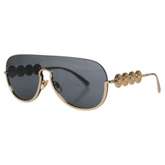 Versace, Rimless sunglasses with gold medusa coins
