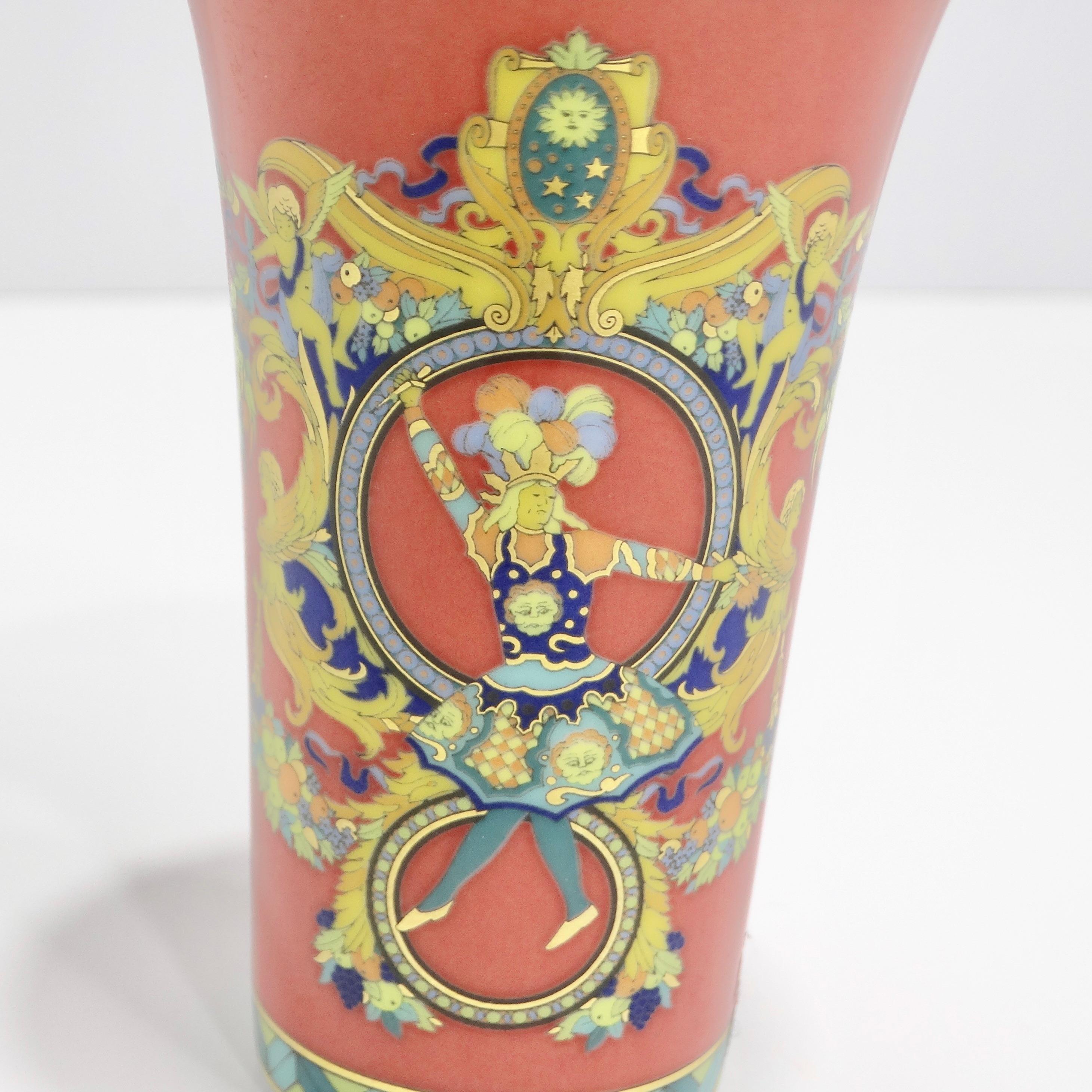 Introducing the Versace Rosenthal 1990s Le Roi King Sun Porcelain Vase, a mini masterpiece that transforms any space into an artful haven. Crafted with precision, this porcelain vase features a detailed 'Le Roi King Sun' multicolor geometric design,