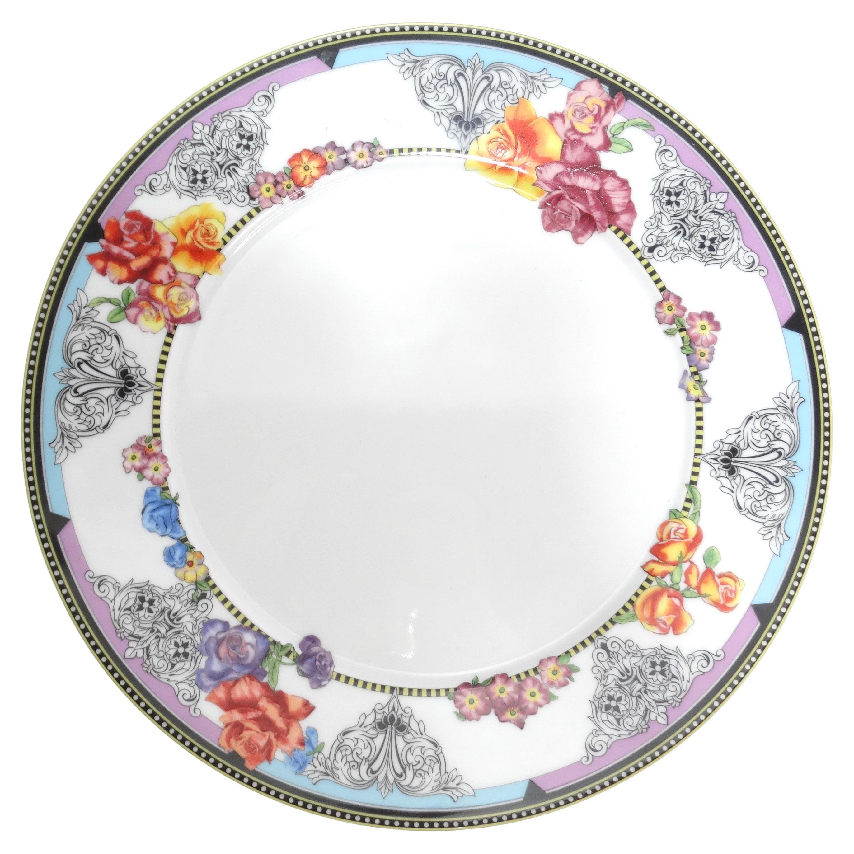 Introducing the Versace Rosenthal 1990s Porcelain Hot Flowers Salad Plate, a stunning and luxurious addition to your tableware collection. This porcelain salad/dessert plate features a whimsical print adorned with detailed multicolor roses, black