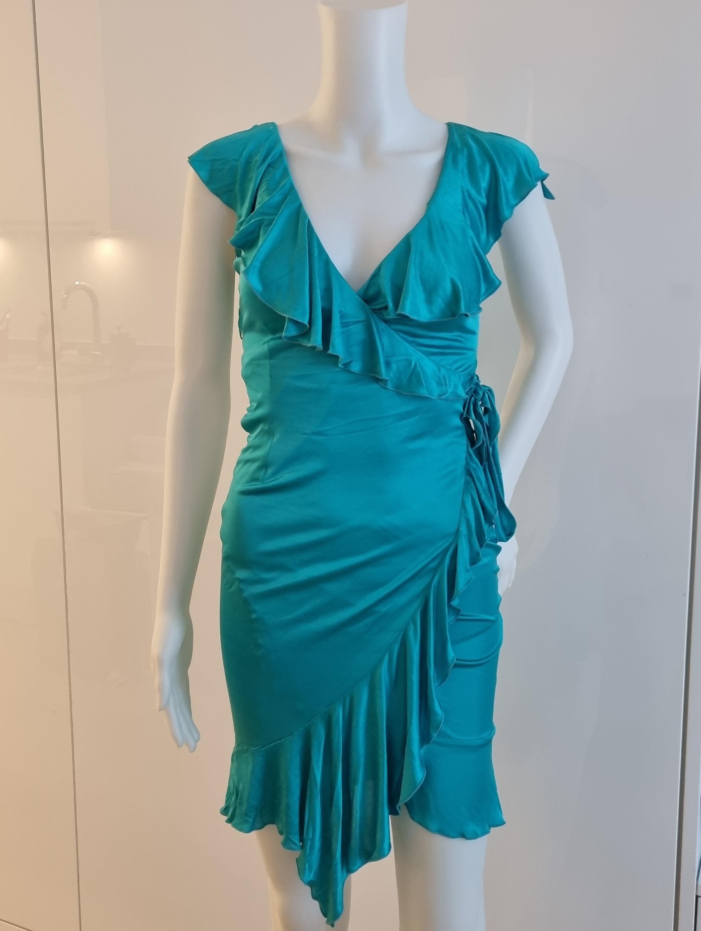 My Runway Archive presents this Iconic turquoise ruffled runway dress from the Versace SS 2004 collection. Also featured in the ad campaign. Madonna also wore this dress to the Grammys in pink. 
Material: Viscose
Size: Italian size 38 equivalent of