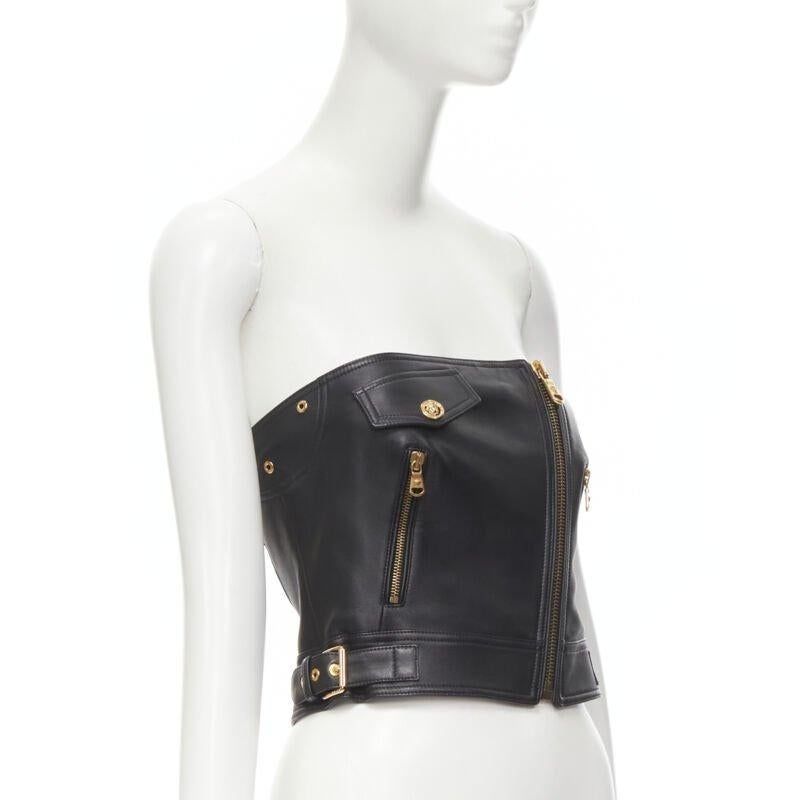 VERSACE Runway black leather gold-tone Medusa biker bustier top IT38 XS
Reference: TGAS/C00017
Brand: Versace
Designer: Donatella Versace
Collection: Runway
Material: Leather
Color: Black, Gold
Pattern: Solid
Closure: Zip
Lining:  Silk
Extra