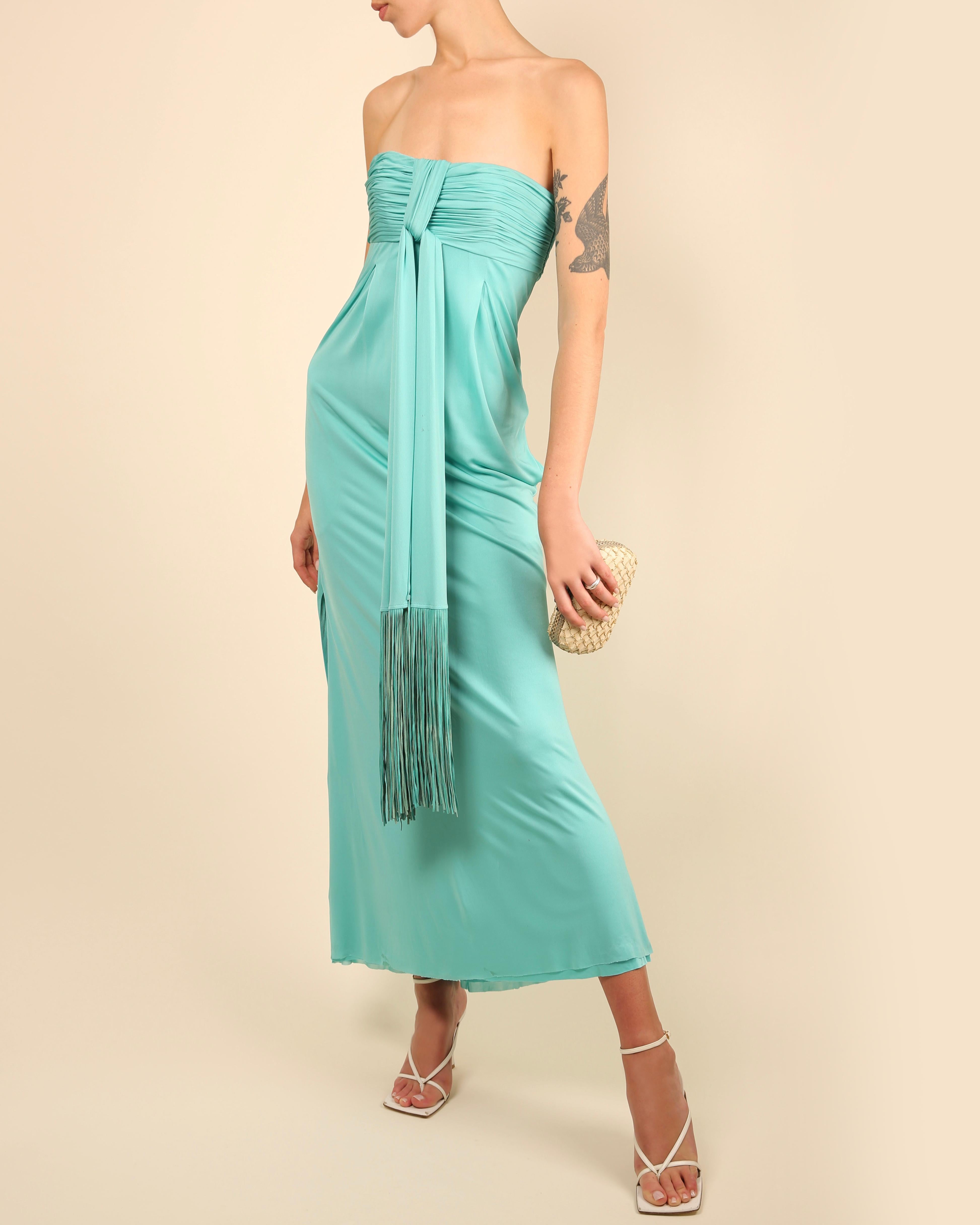 LOVE LALI Vintage

Versace Spring Summer 2008 strapless dress in turquoise
Ruched bust
Inner boned corset with underwired cups
Long ties at the bust with long leather tassels, these can be knotted, tied, wrapped around the body...
Double