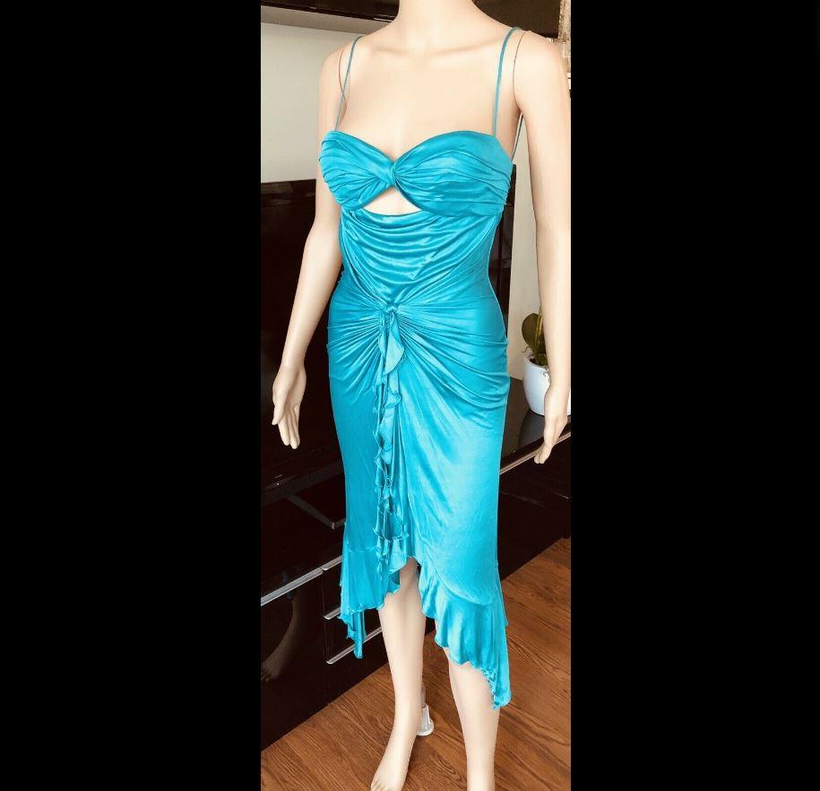 Versace S/S 2004 Sexy Plunging Neckline Cutout Dress IT 42

Versace sleeveless gown with bustier neckline, ruffled trim, cutout at bodice, draping throughout and concealed zip closure at back. Condition is pre-owned with light pulling throughout the