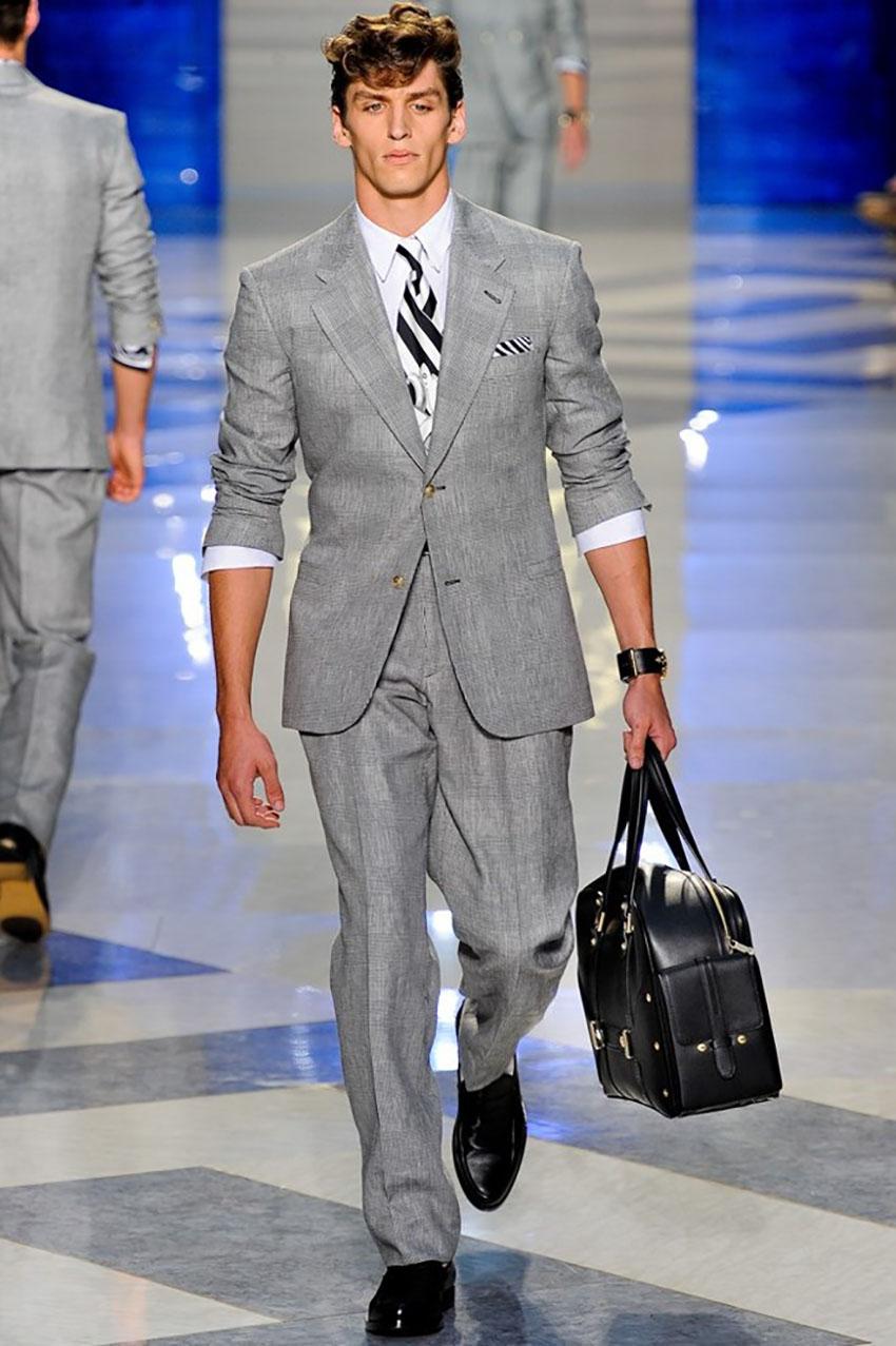 VERSACE 

Actual runway sample Spring/Summer 2012 look # 2
Optic Gray suit  
2 Front White Gold-tone Buttons 
Two side pockets 
1 White Gold-tone Button on sleeves
IT Size 48 -  US 38 (M)

Content: 55% linen, 45% wool 
semi-linen