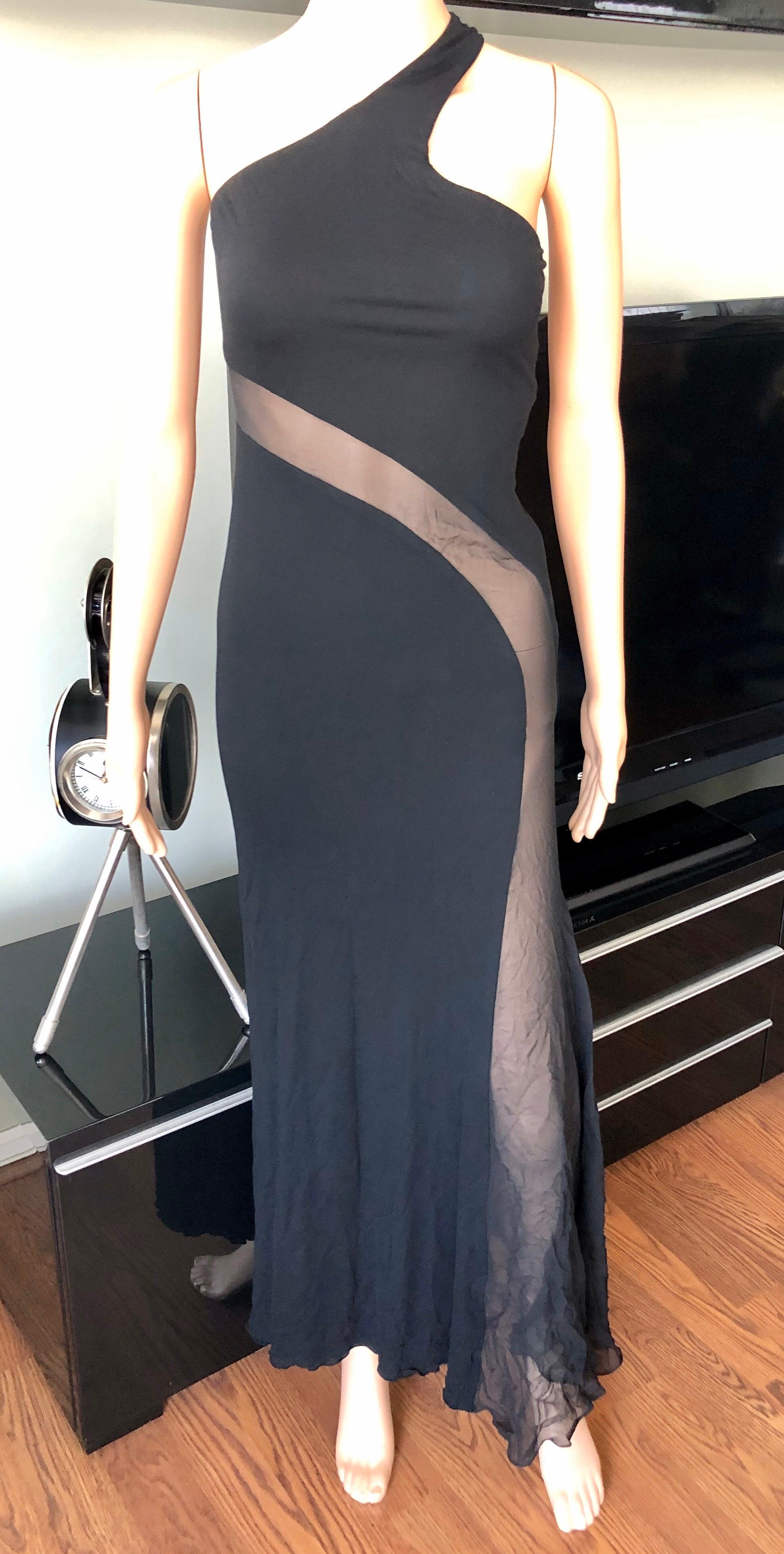 Versace Sheer Cutout Panel Black Evening Dress Gown IT 38

Versace black evening dress featuring sheer cutout panel, logo embellished closure at back and concealed zip closure at side.
