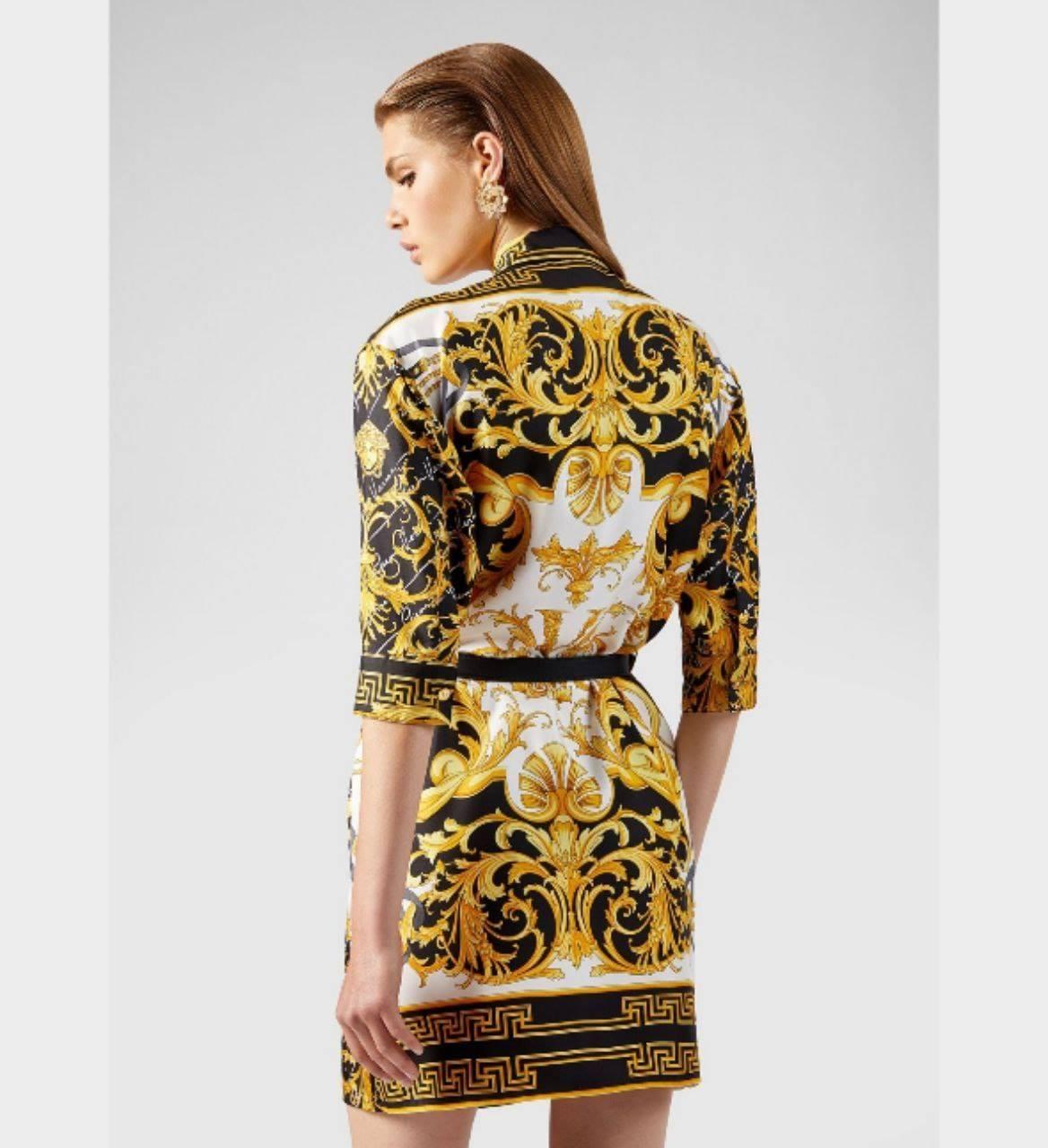  VERSACE

This black, white and golden yellow Versace Baroque print silk shirt dress is made in Italy and is covered
 in the Baroque and Rodeo Queen prints.
 It features a spread collar, 
concealed front button fastening,
 three quarter sleeves and