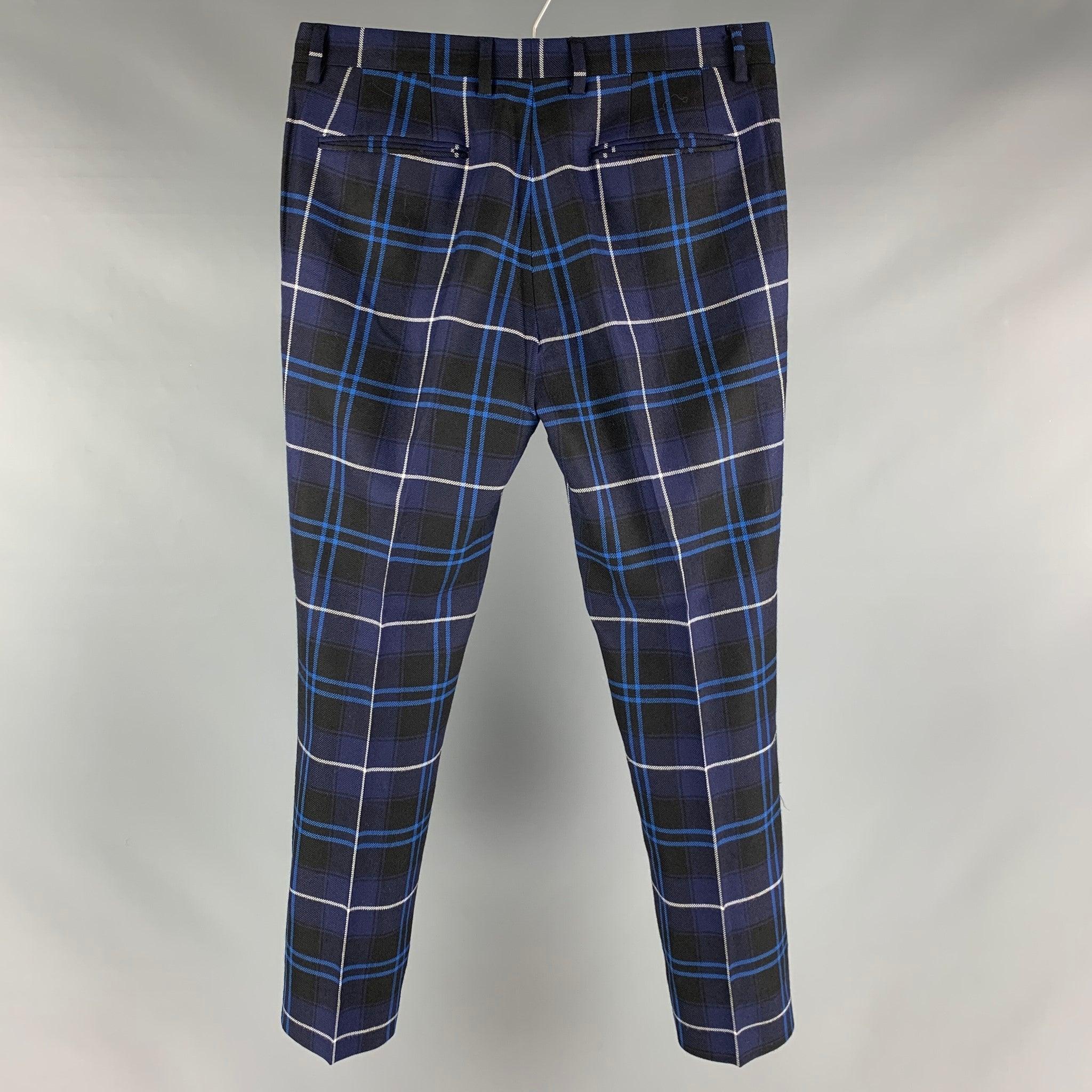 VERSACE dress pants comes in a blue, navy, and white plaid wool featuring a slim fit, flat front, and a zip fly closure. Made in ItalyExcellent Pre-Owned Condition. 

Marked:  48 

Measurements: 
 Waist: 32 inches Rise: 8 inches Inseam: 29.5 inches