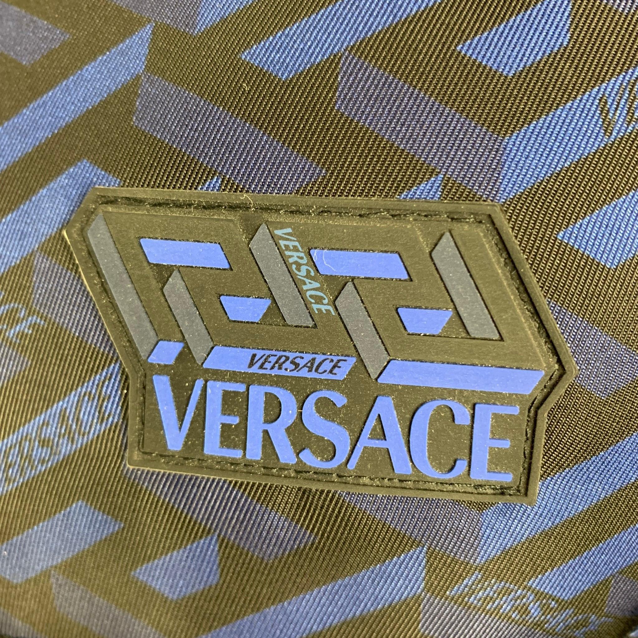 VERSACE Jacket comes in black and navy polyester nylon woven material featuring a versace motif print, puffer look, removable hood, high collar, and
 zipper closure. Made in Italy.Excellent Pre-Owned Condition. 

Marked:   46 

Measurements: 
 