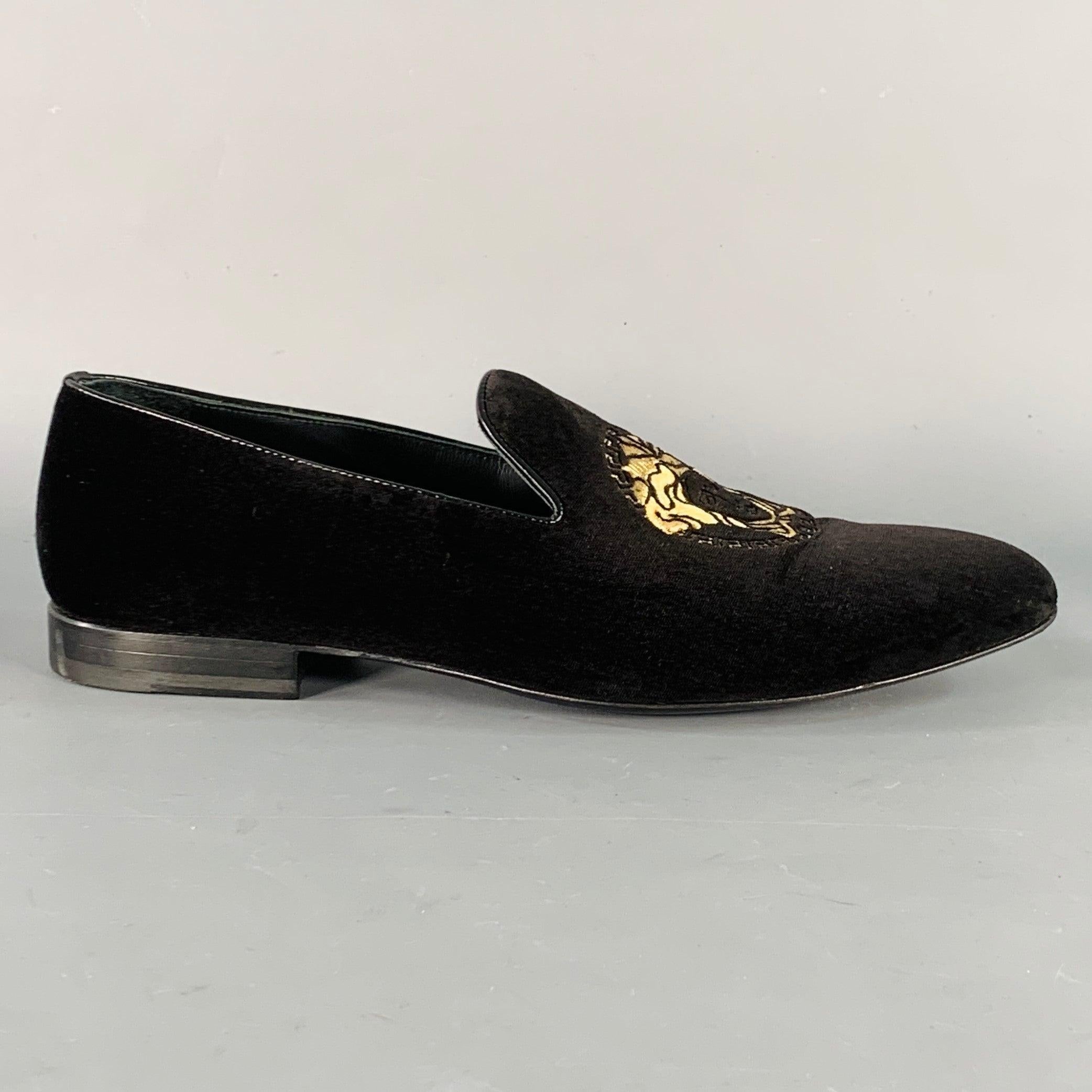 VERSACE loafers
in a black velvet featuring black leather trim, gold tone embroidered Medusa's head design, and slip on closure. Comes with dust bag. Made in Italy.Excellent Pre-Owned Condition. 

Marked:   6488 42Outsole: 11.5 inches  x 3.75 inches