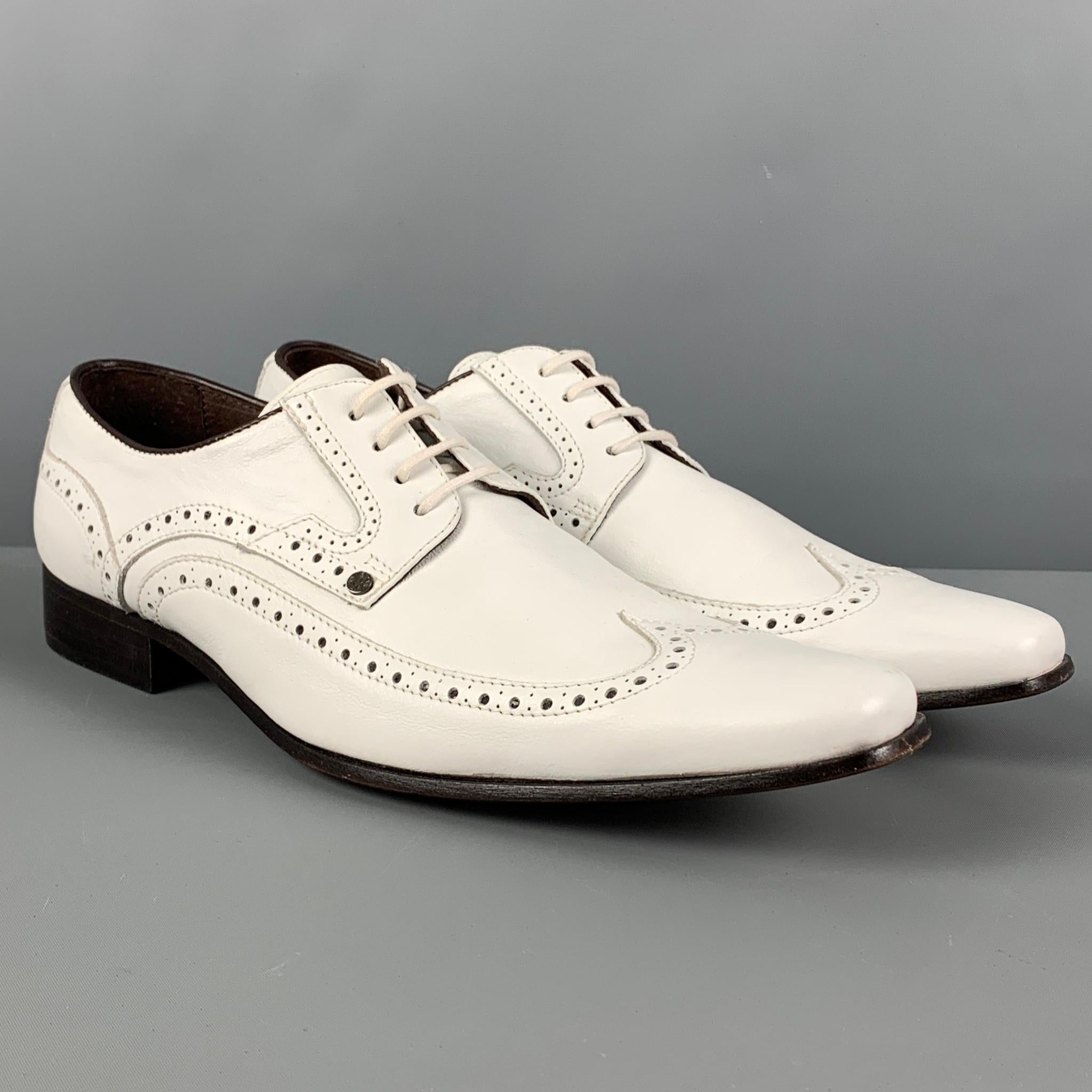 VERSACE shoes comes in a white perforated leather featuring a square toe, top stitching, and a lace up closure. Includes box. Made in Italy. 

Very Good Pre-Owned Condition. Light wear. As-is.
Marked: 42

Outsole: 12.25 in. x 4 in.