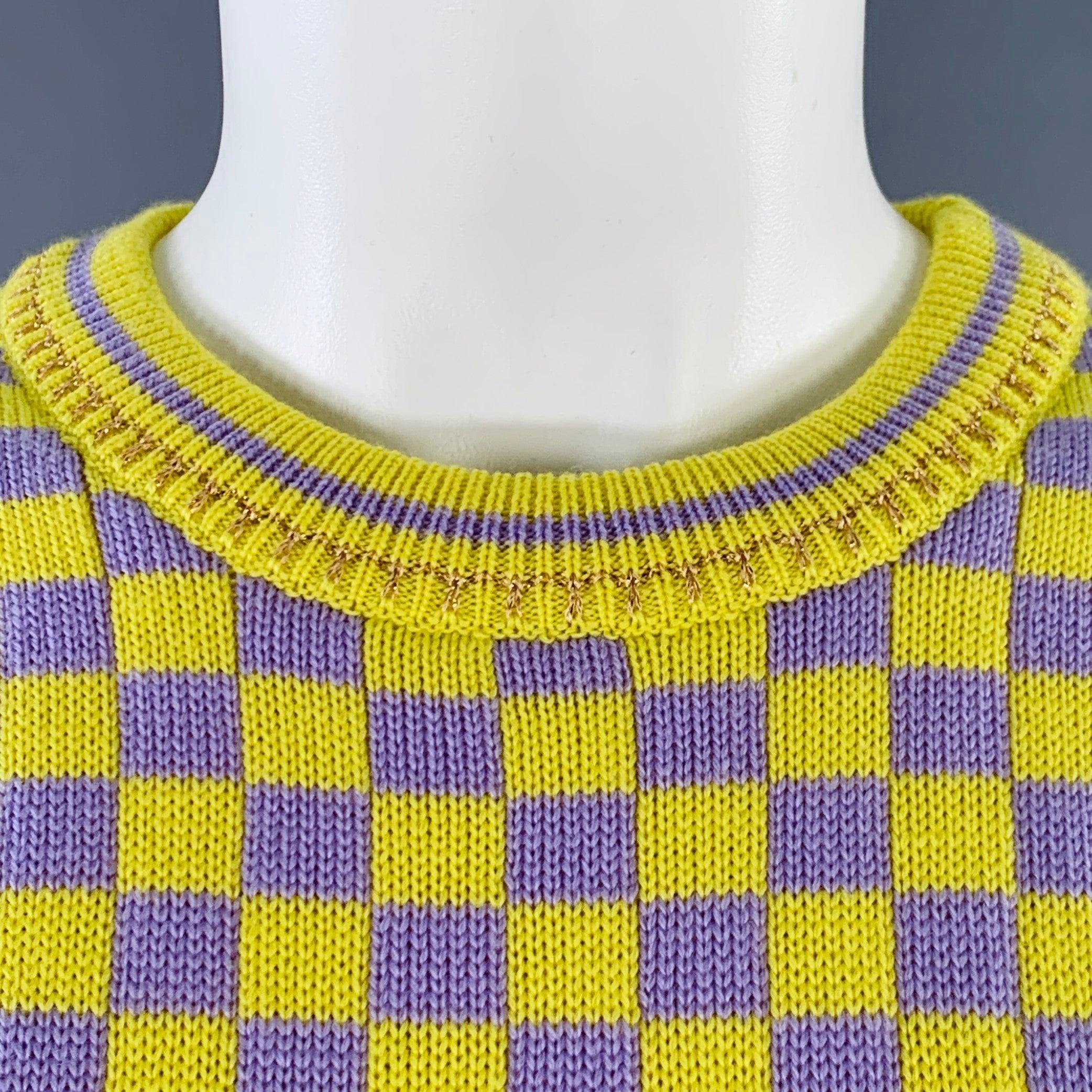 VERSACE casual top
in a yellow and lavender wool blend knit featuring a checkered pattern, gold tone metallic trim accents, and crew neck. Made in Italy.Excellent Pre-Owned Condition. 

Marked:   IT 38 

Measurements: 
 
Shoulder: 15 inches Bust: 32