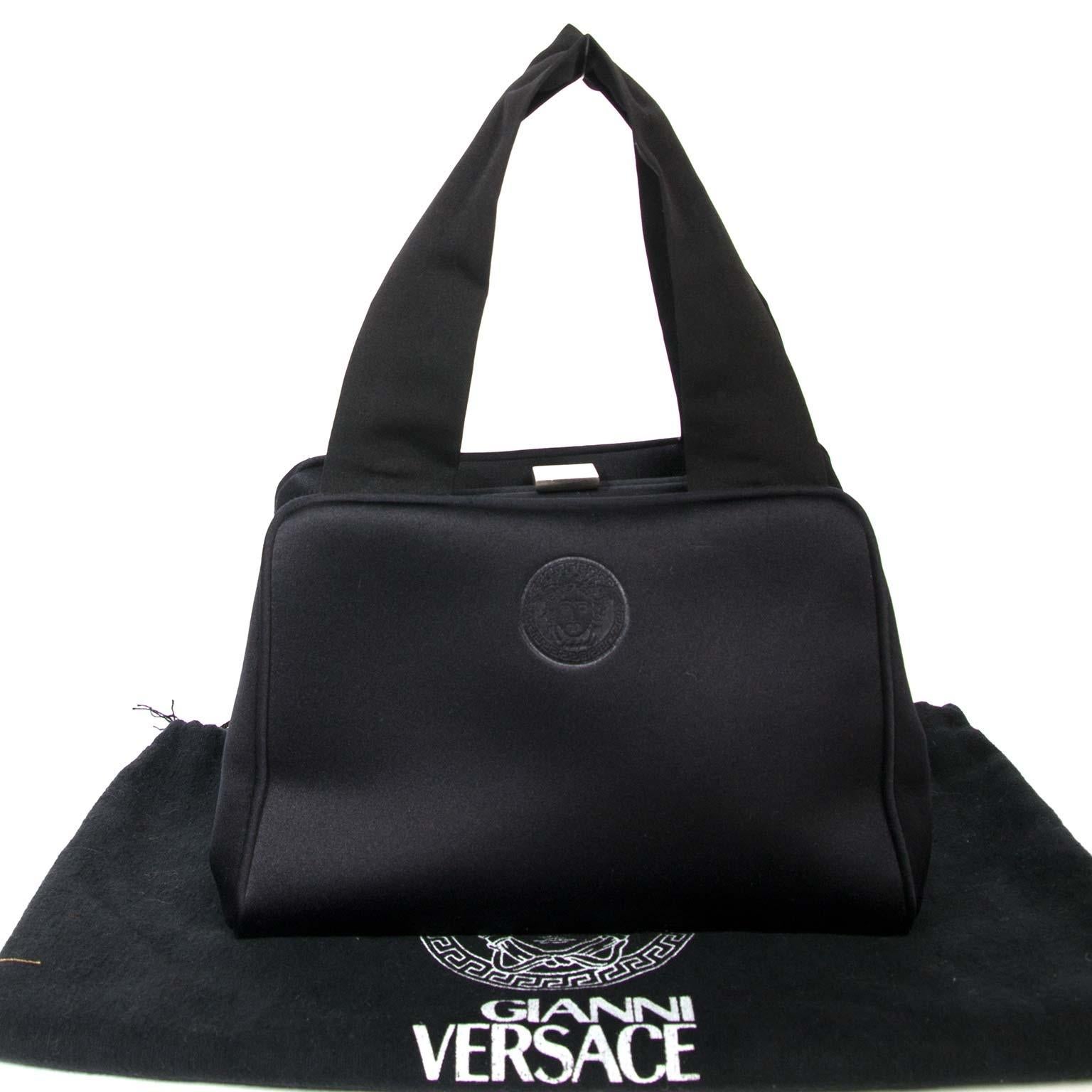Very good preloved condition

Versace Small Black Satin Bag 

This small stunning bag by Versace adds some class to your outfit.
It's perfect for the night out. 
The inside consist of one main compartment with a side pocket. 
It opens and closes